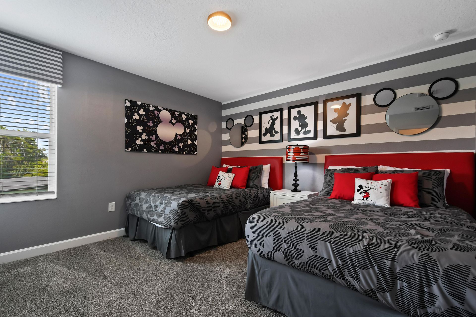 Whimsical Disney-themed bedroom with cozy beds, playful decor, and magical charm.