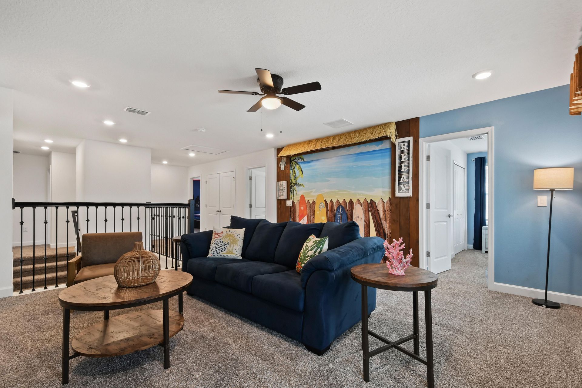 Unwind in this inviting loft space featuring comfortable seating and a laid-back ambiance, perfect for family gatherings or quiet relaxation.