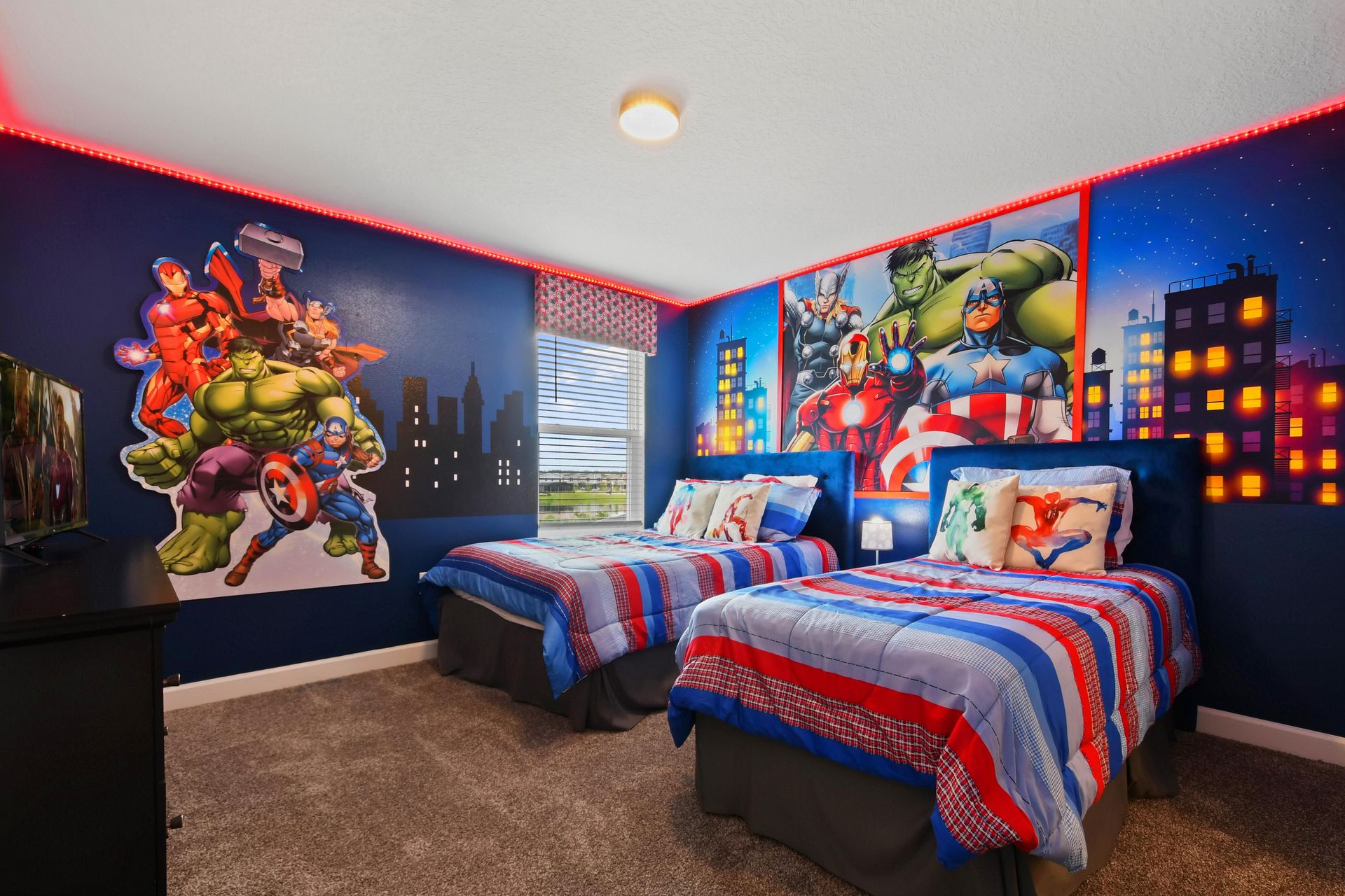 Action-packed superhero-themed bedroom with twin beds, bold decor, and vibrant lighting.