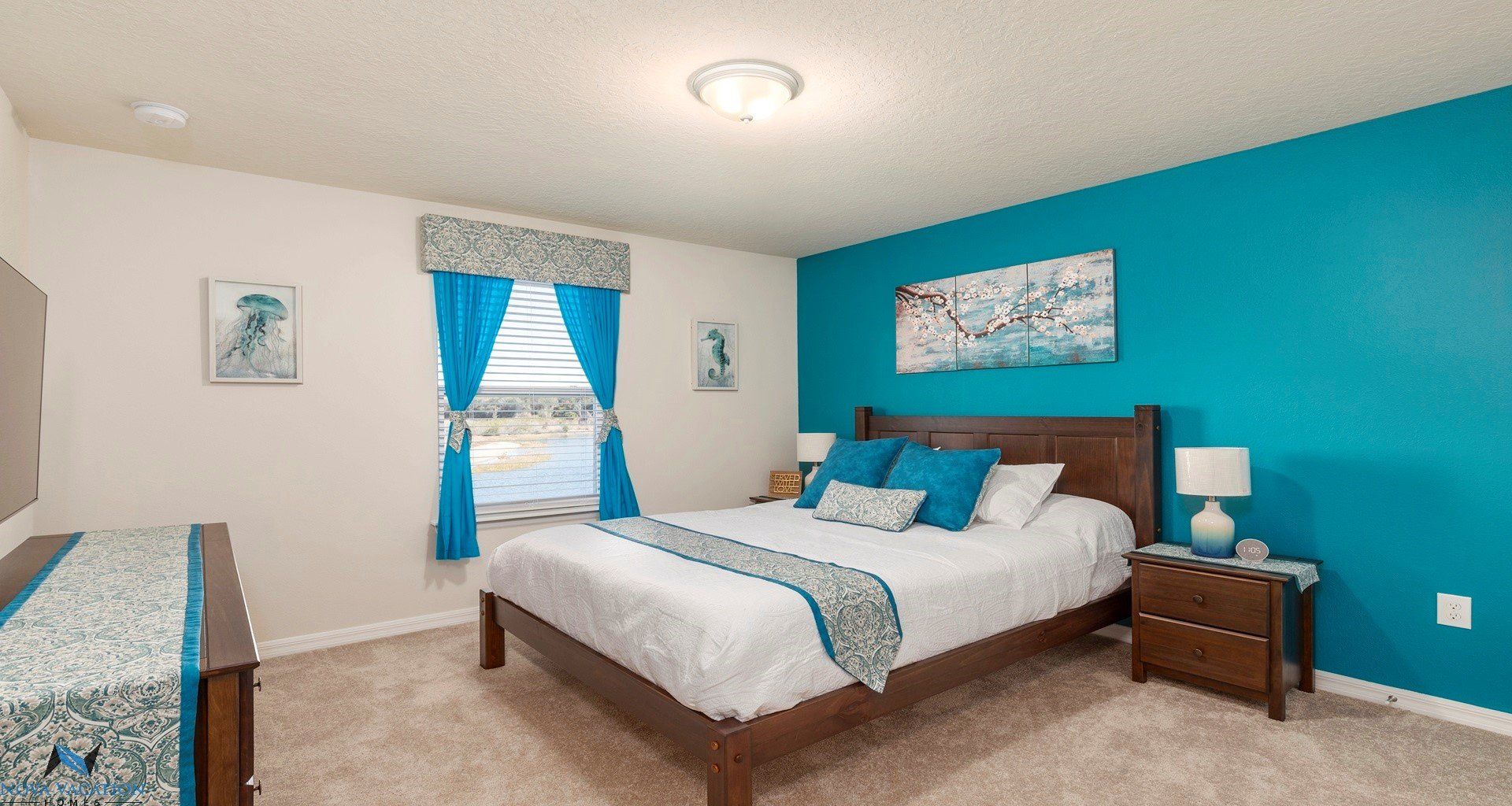 Beautiful bedroom includes a comfy queen bed and a large TV.