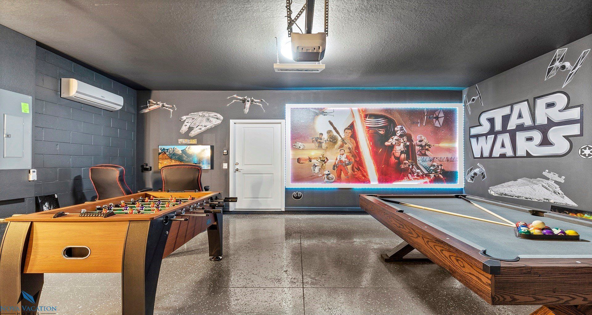 Star Wars themed game room with foosball and pool table.
