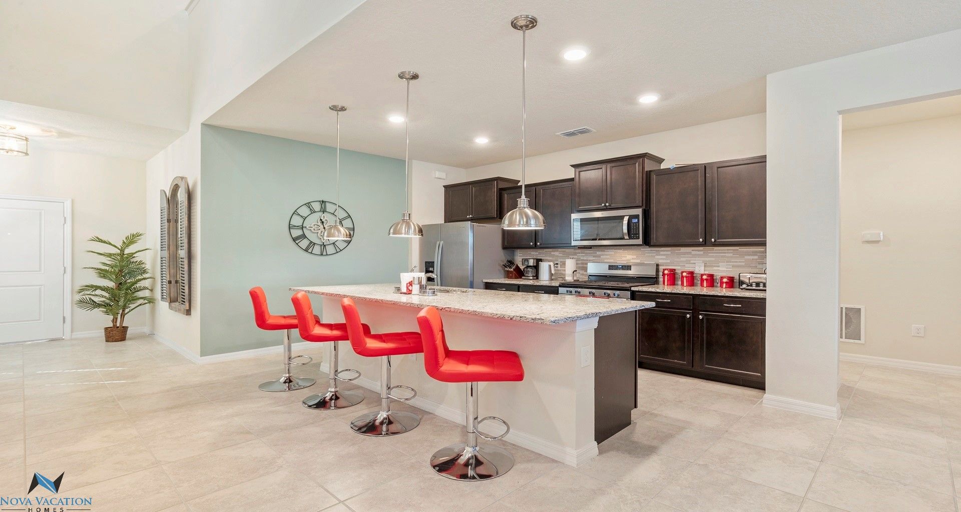 Modern kitchen: awaits with sleek counters & breakfast bar
