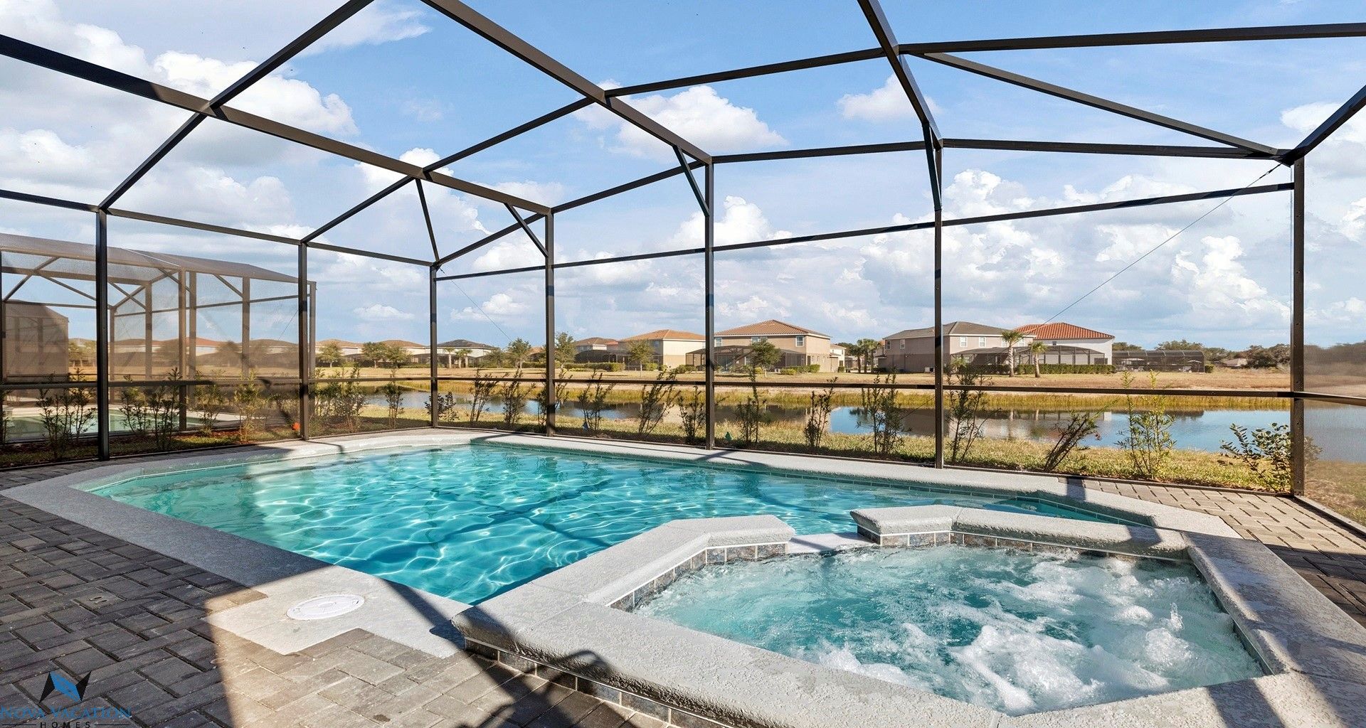 Luxurious private pool and spa offering a beautiful lake side view.