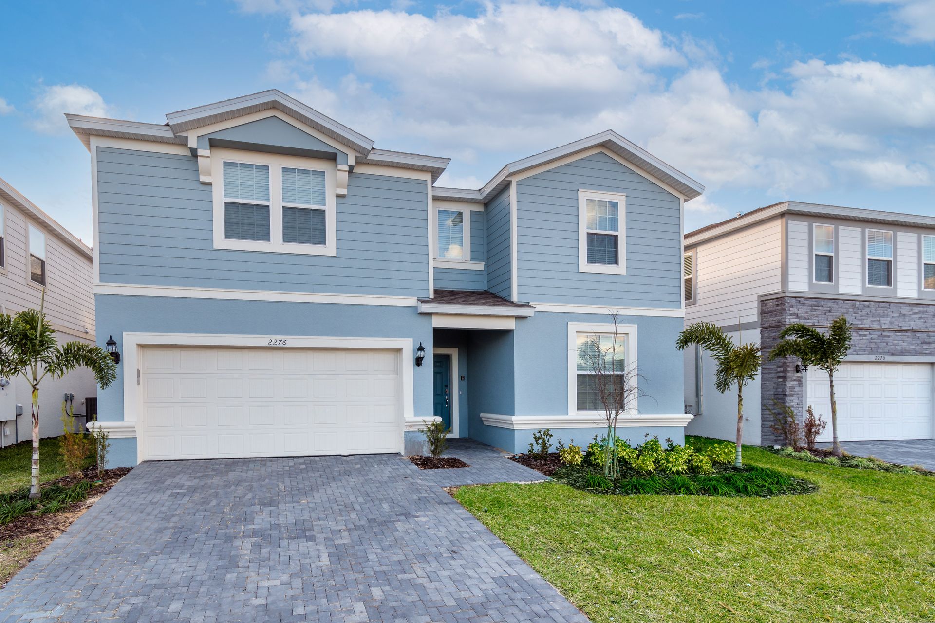 Modern & spacious vacation home with stylish design, lush landscaping & cozy charm!