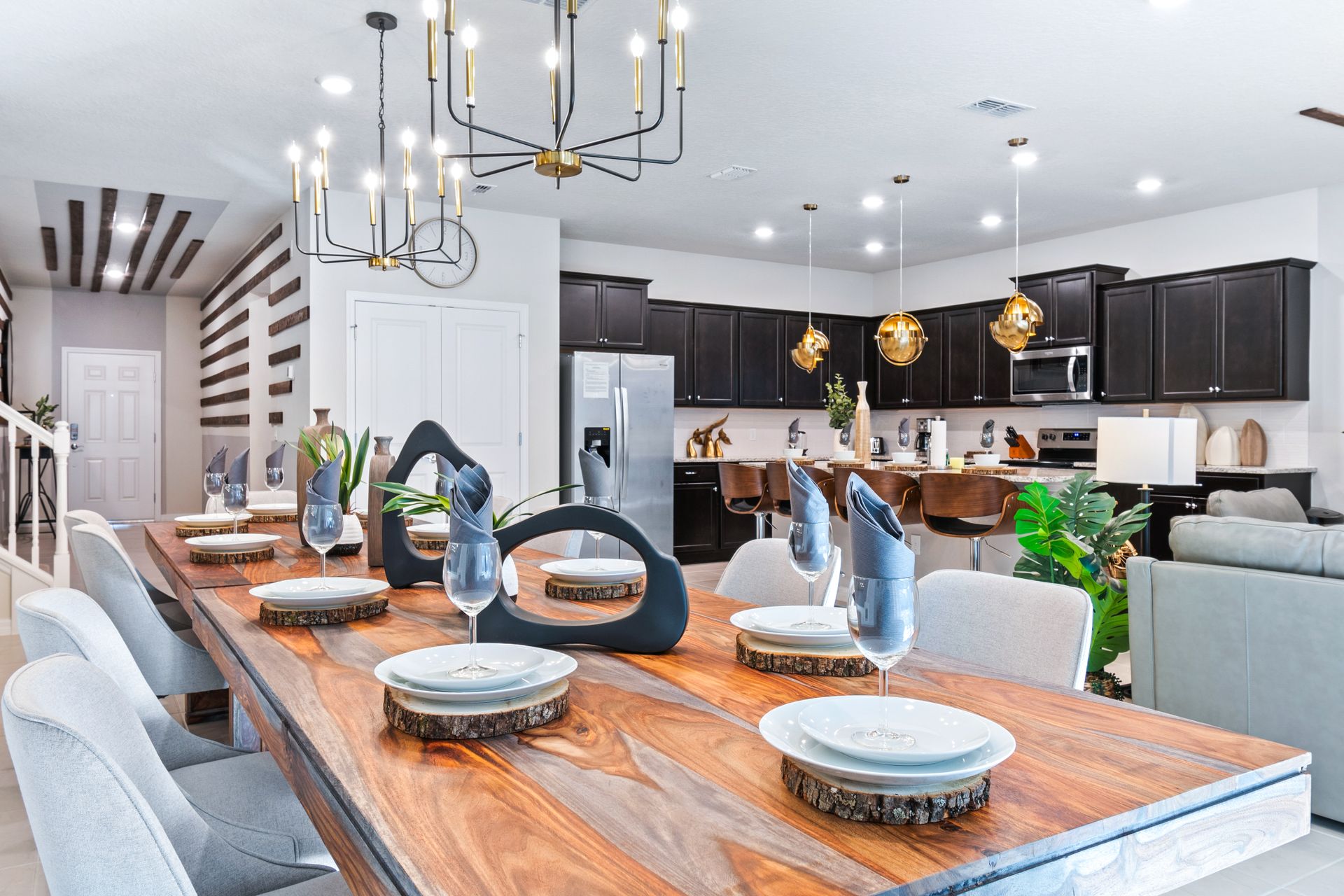 Luxury dining & kitchen space with modern décor, warm wood tones & elegant lighting!