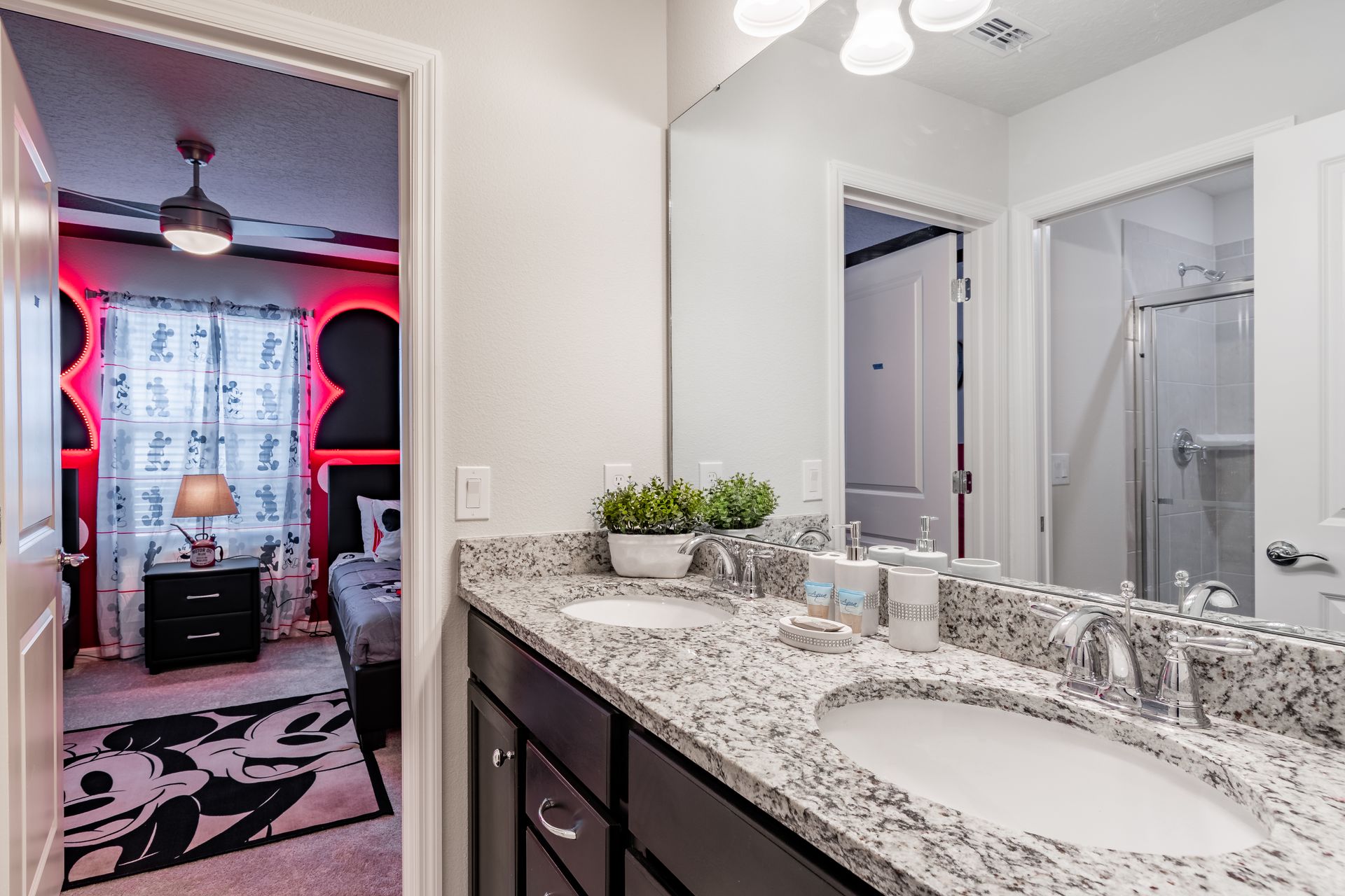 Stylish Jack-and-Jill bathroom with dual sinks, granite countertops & modern design!