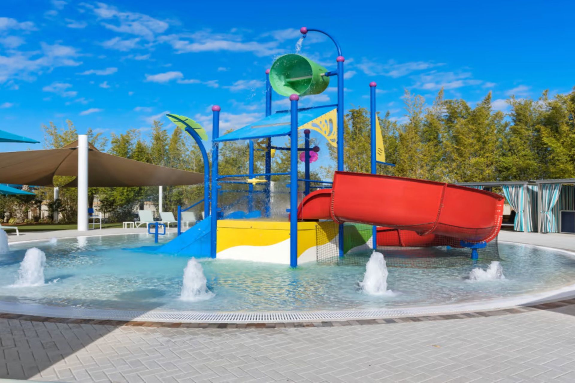 Splash into fun! Kid-friendly water play area with slides & fountains! 