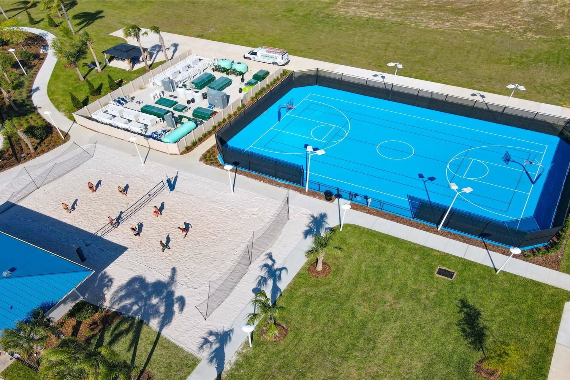 Game time! Enjoy sand volleyball & a full basketball court at this resort! 