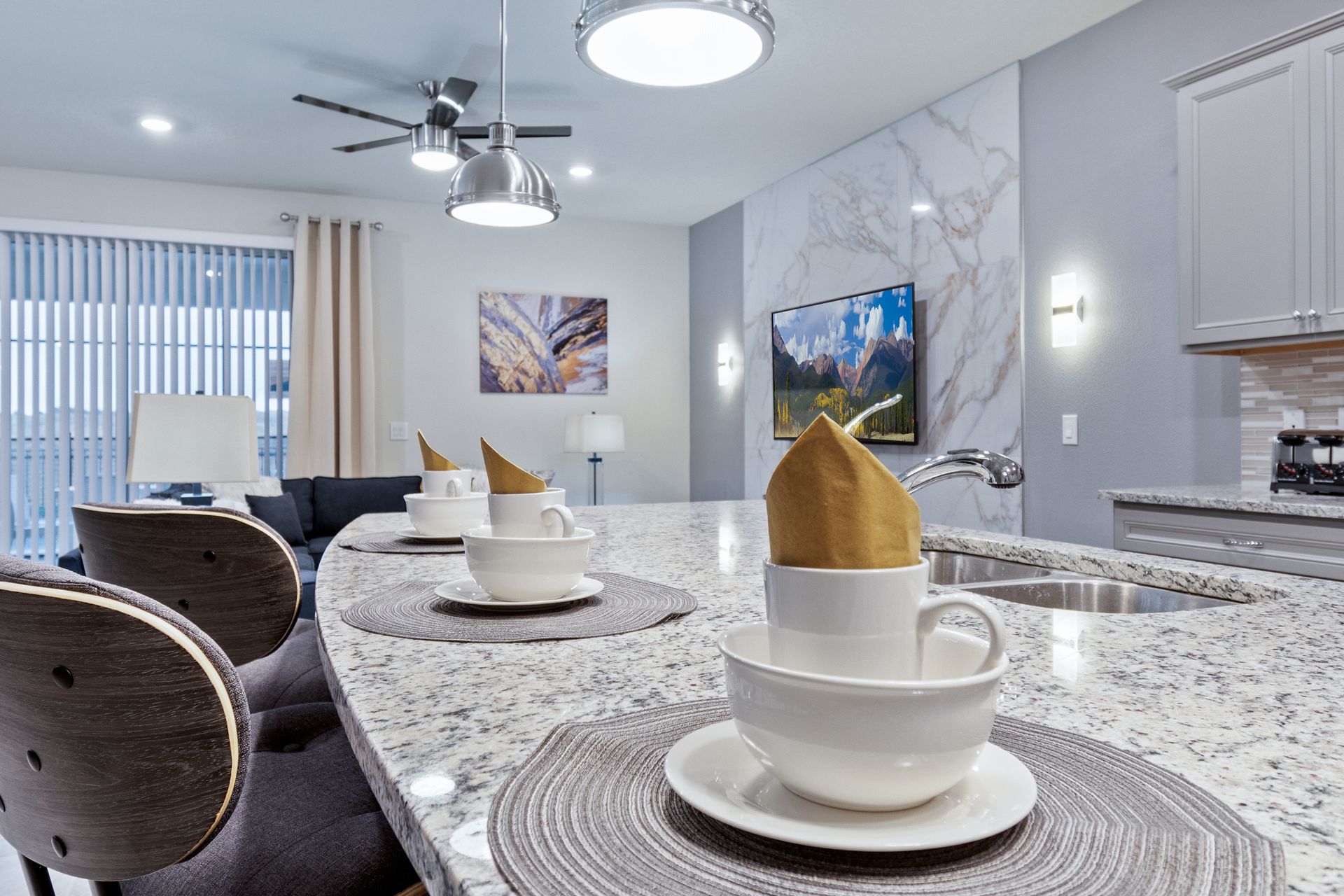Inviting breakfast bar with elegant place settings and granite countertop.