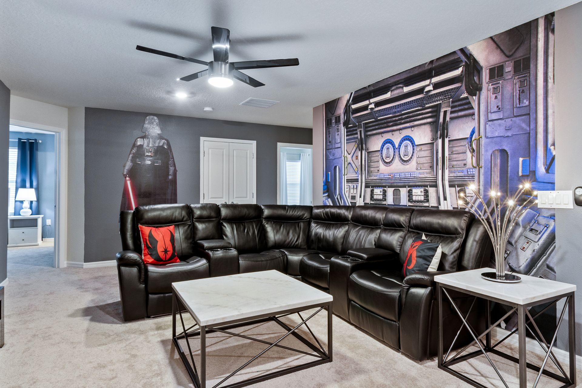 Sci-fi themed lounge with a plush leather sectional, perfect for movie nights.