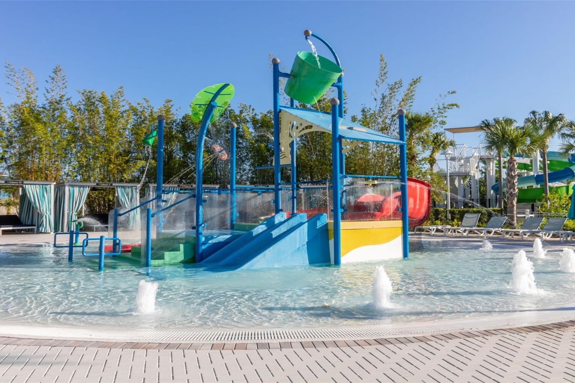 Vibrant splash pad with slides, tipping buckets, and fun water fountains!