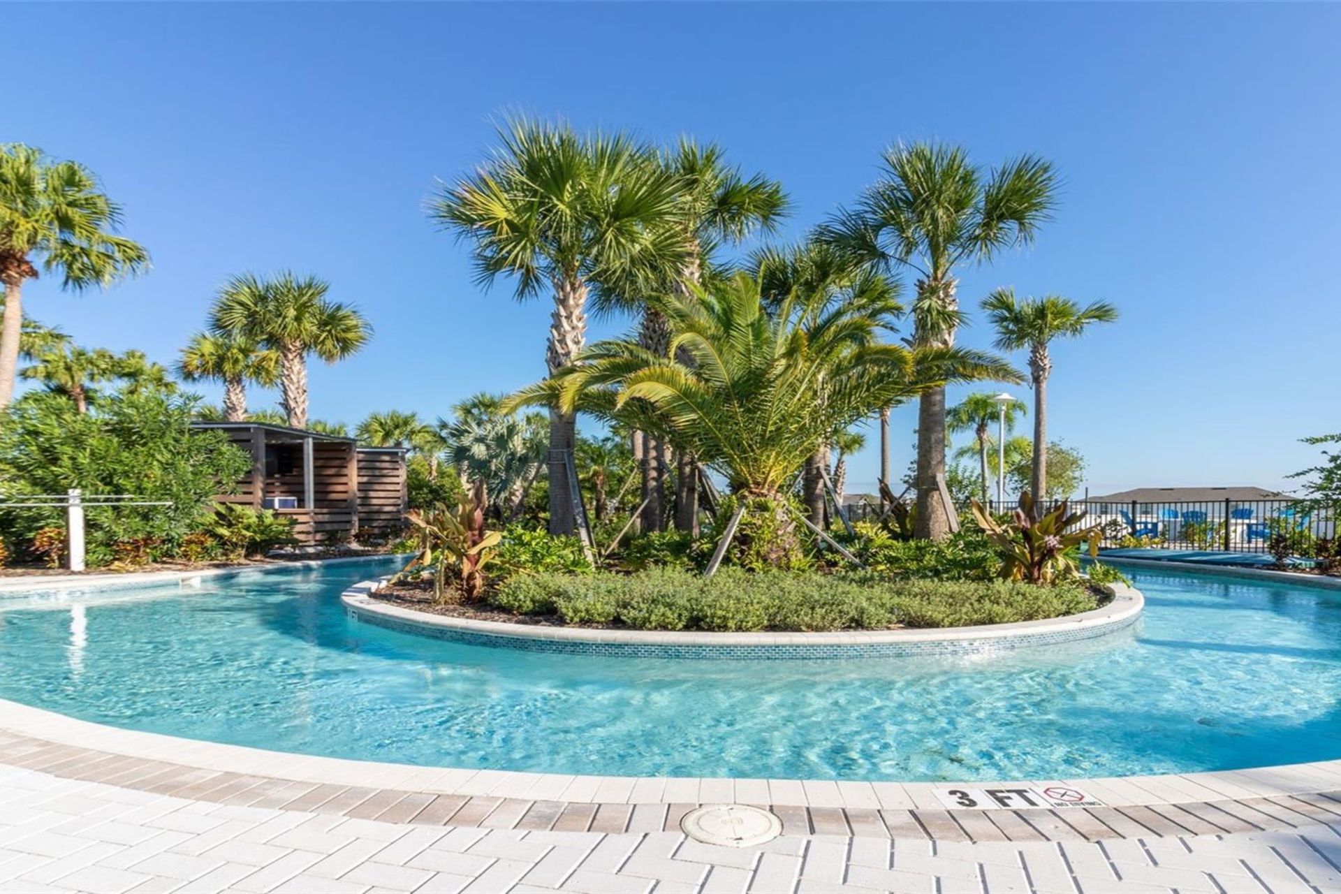 Drift through the serene lazy river surrounded by tropical greenery and sunshine.