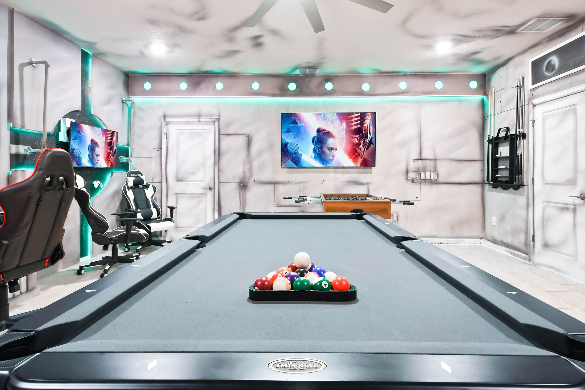 Experience Star Wars excitement in a game room equipped with a pool table and foosball.