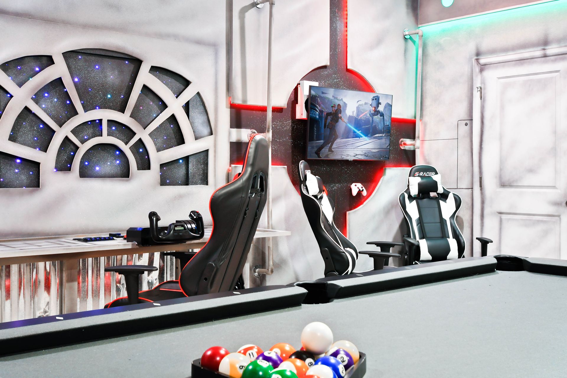 Immersive Star Wars-themed space with gaming chairs, pool table, and galactic vibes!