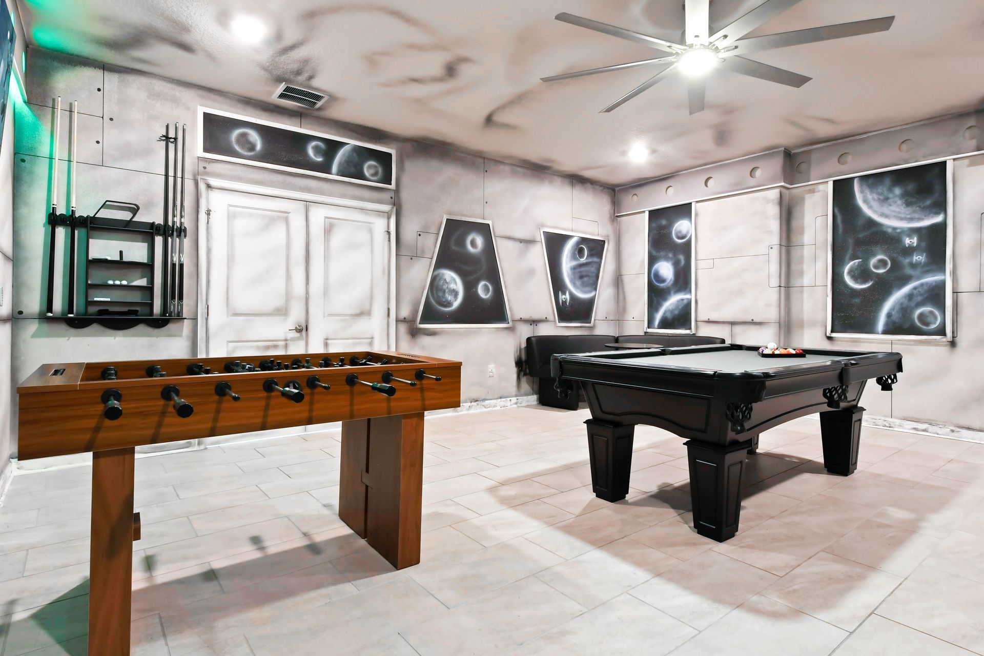 Galactic game room featuring foosball, pool table, and stunning Star Wars murals!