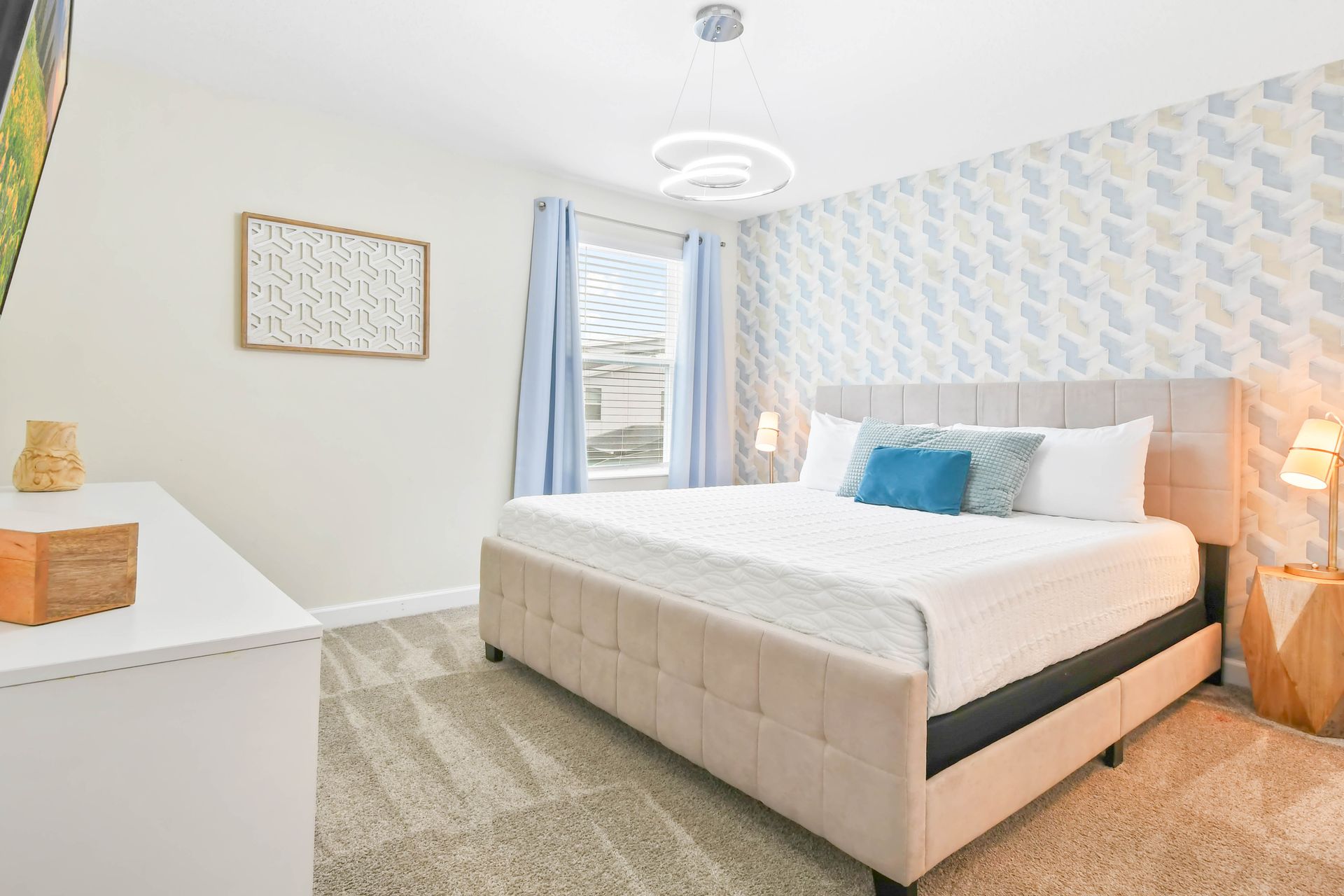 Stylish bedroom with modern decor, cozy bed, geometric wallpaper, and soft lighting!