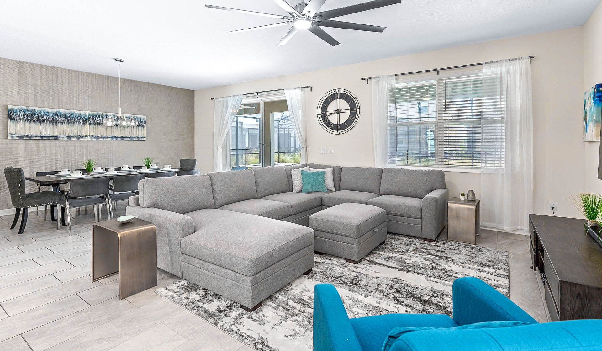 Spacious living area with a comfy sectional, dining for eight, and natural light!