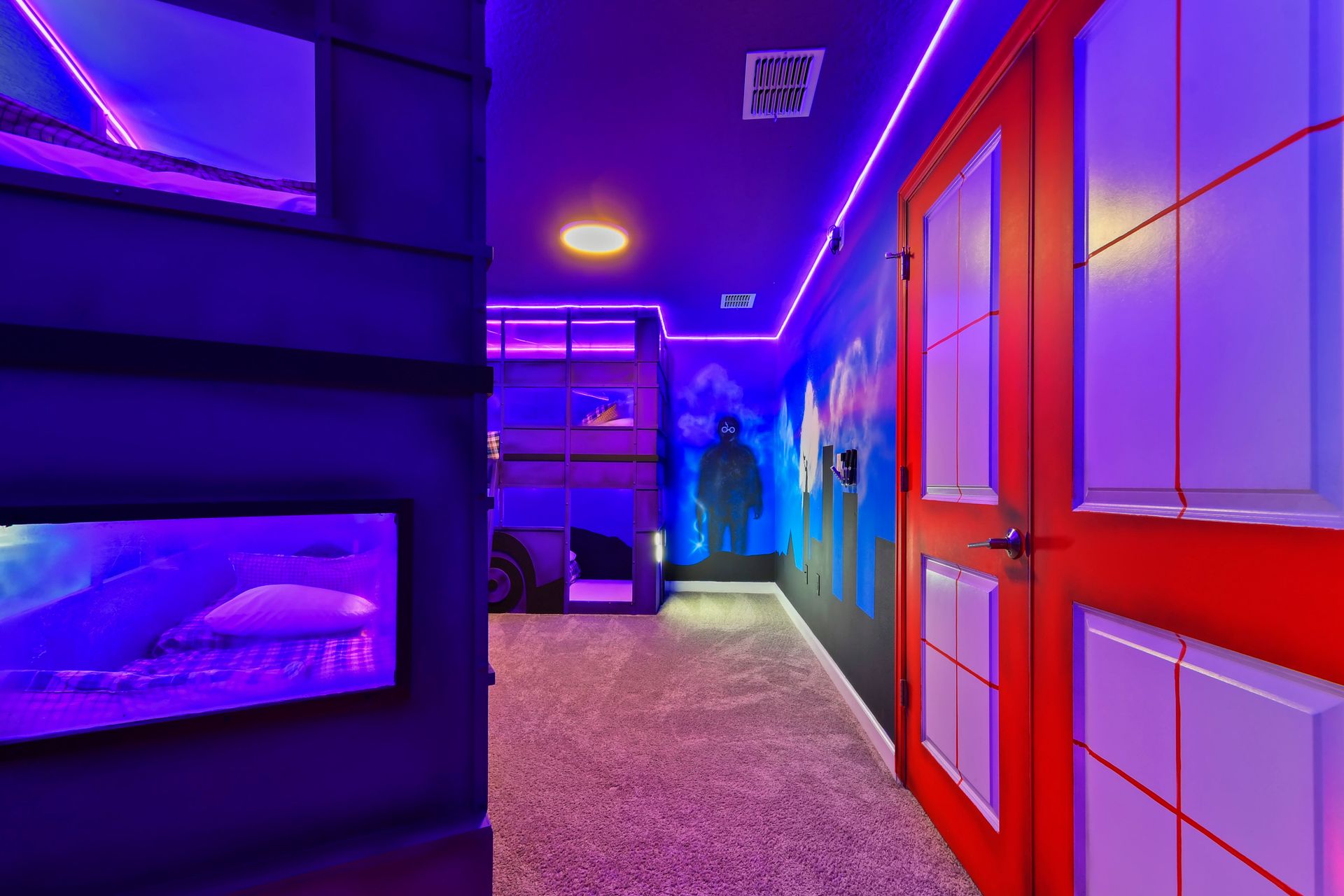 Vibrant superhero-themed bunk room with neon lights, fun murals, and immersive decor!