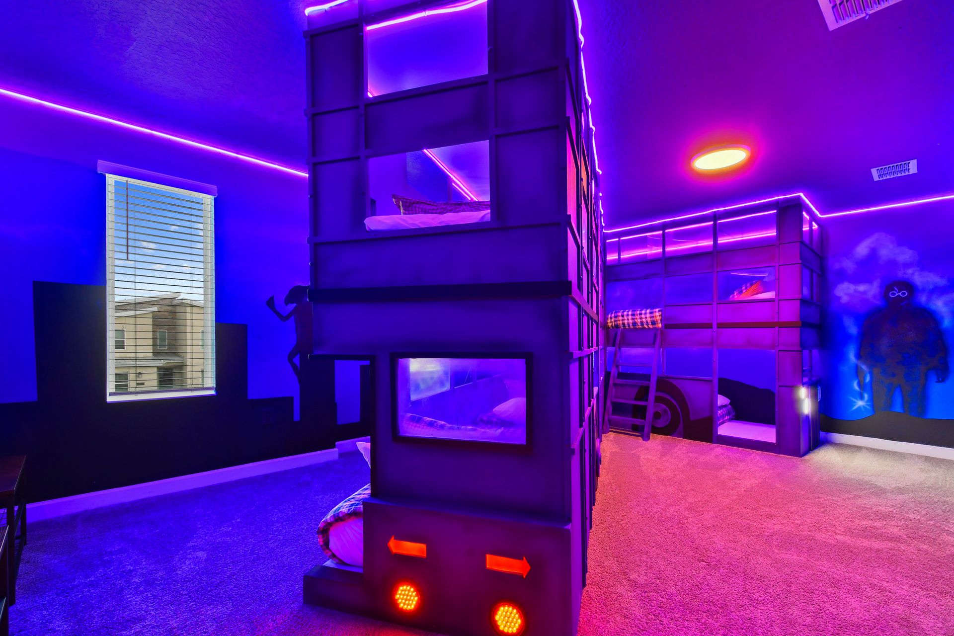 Neon-lit superhero bunk room with immersive designs, perfect for kids and families!