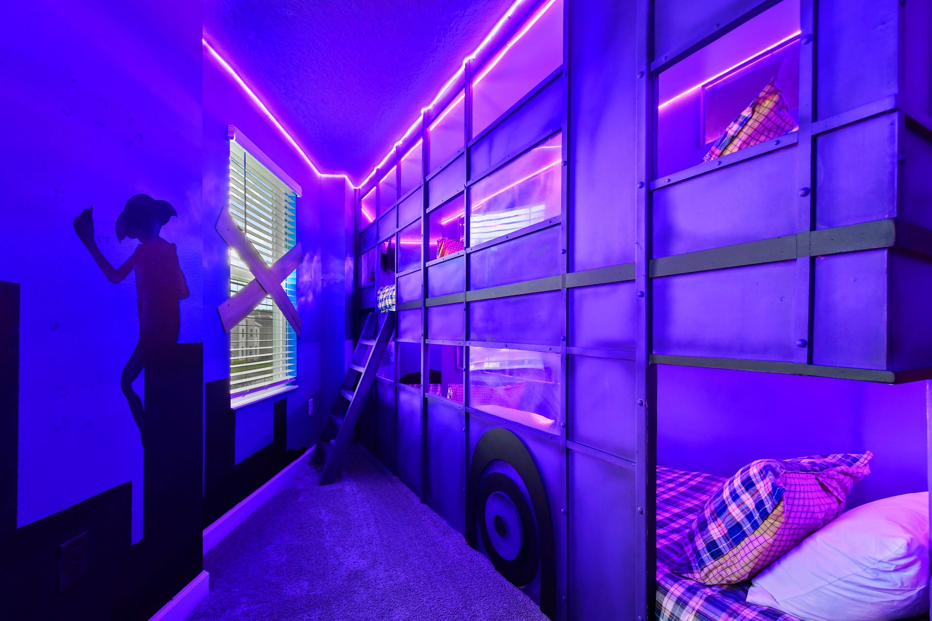 Creative bunk room with neon lighting, cityscape murals, and a playful superhero vibe!