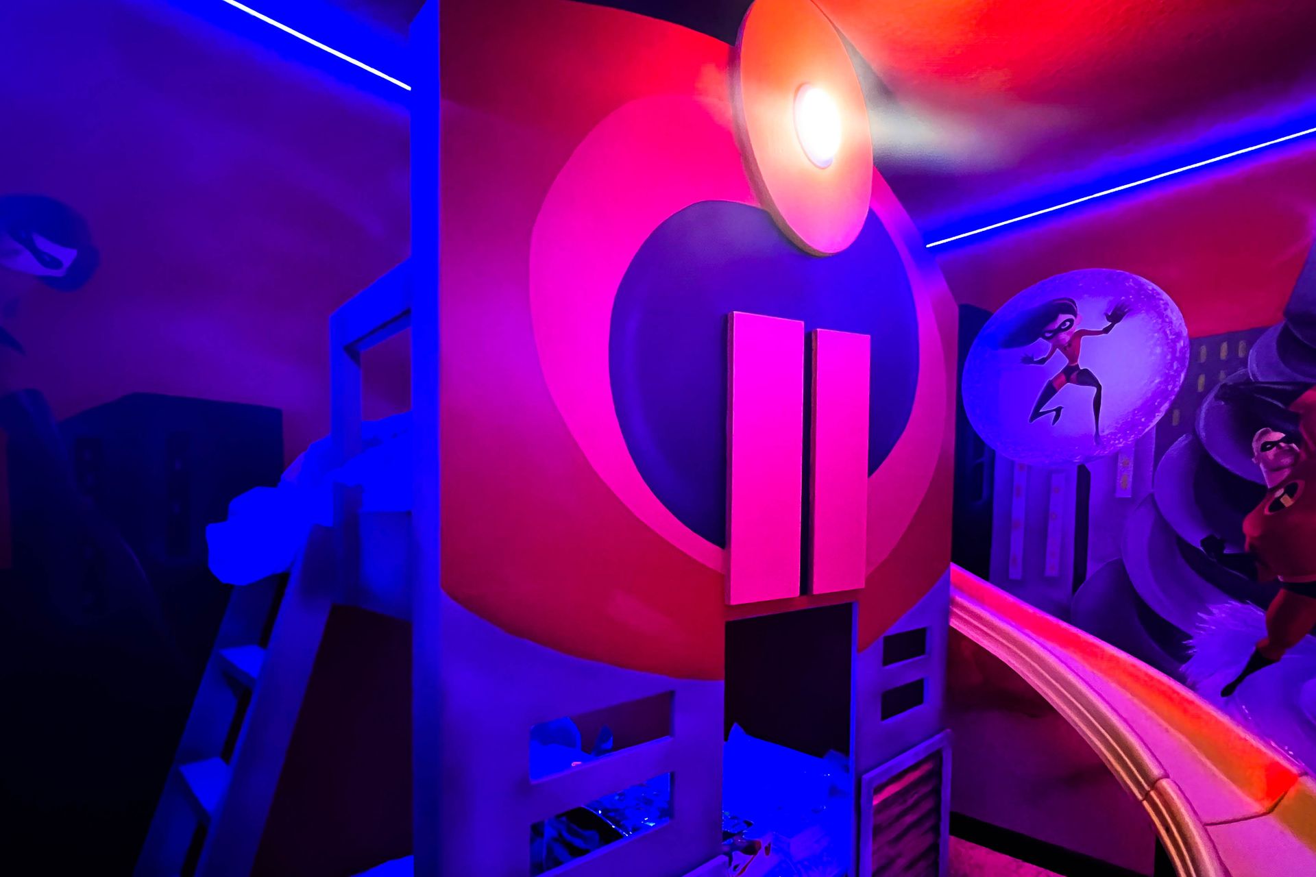 Dive into adventure in this superhero-themed room! Equipped with a slide and vibrant colors, it's perfect for young heroes in training.