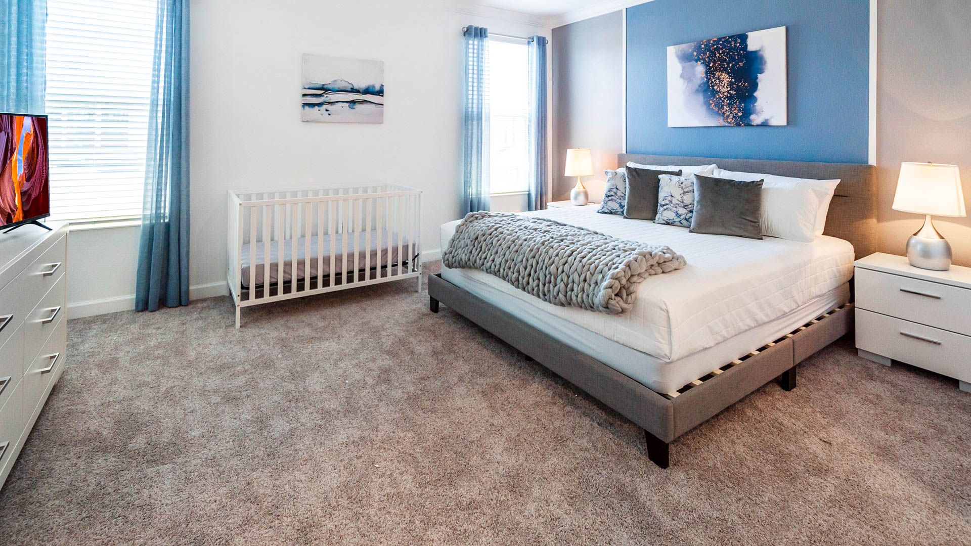 The master bedroom on the ground floor with a luxuriously large king bed