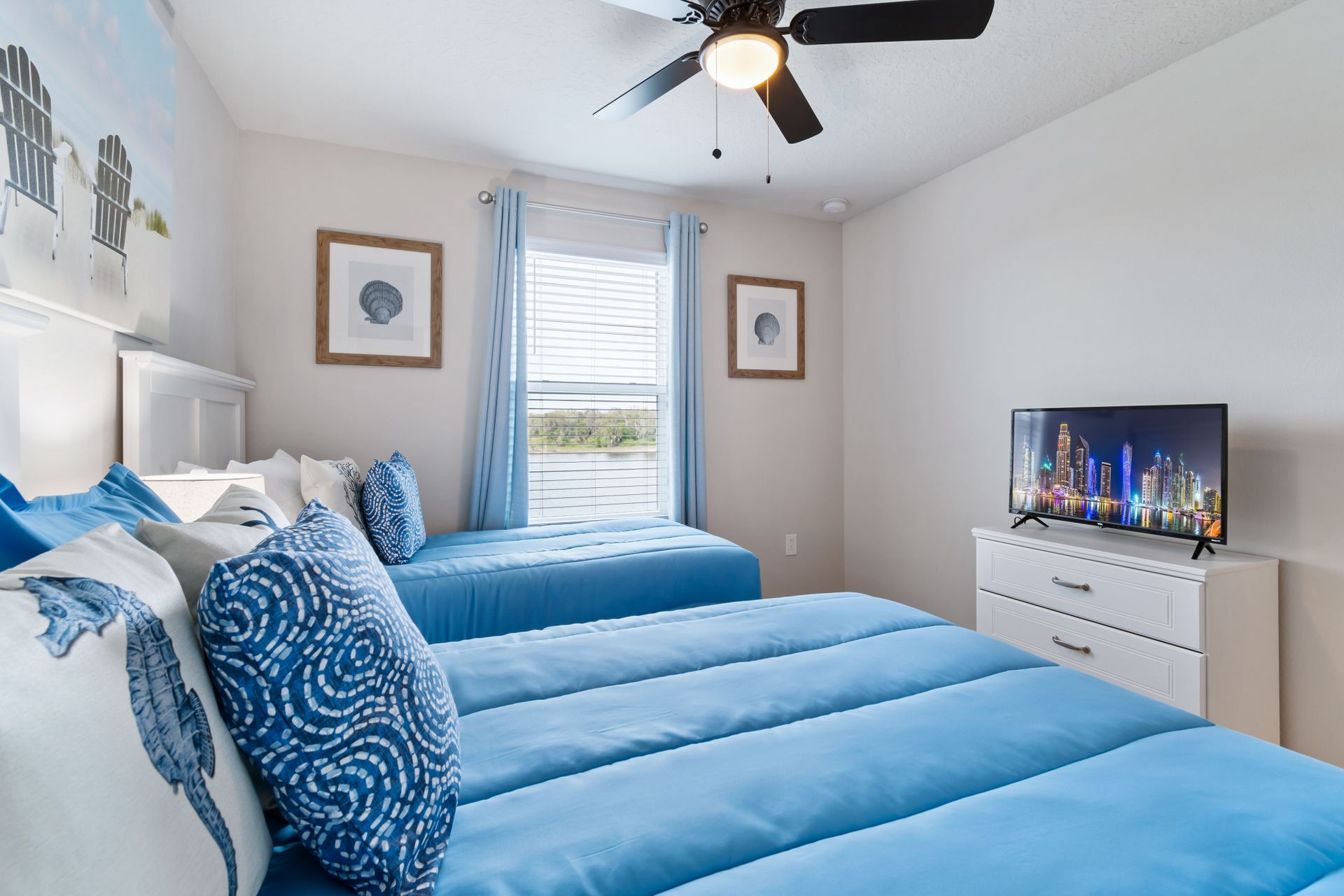 Serenely designed bedroom with one full bed and one twin bed, offering a peaceful and comfortable retreat for a restful night's sleep