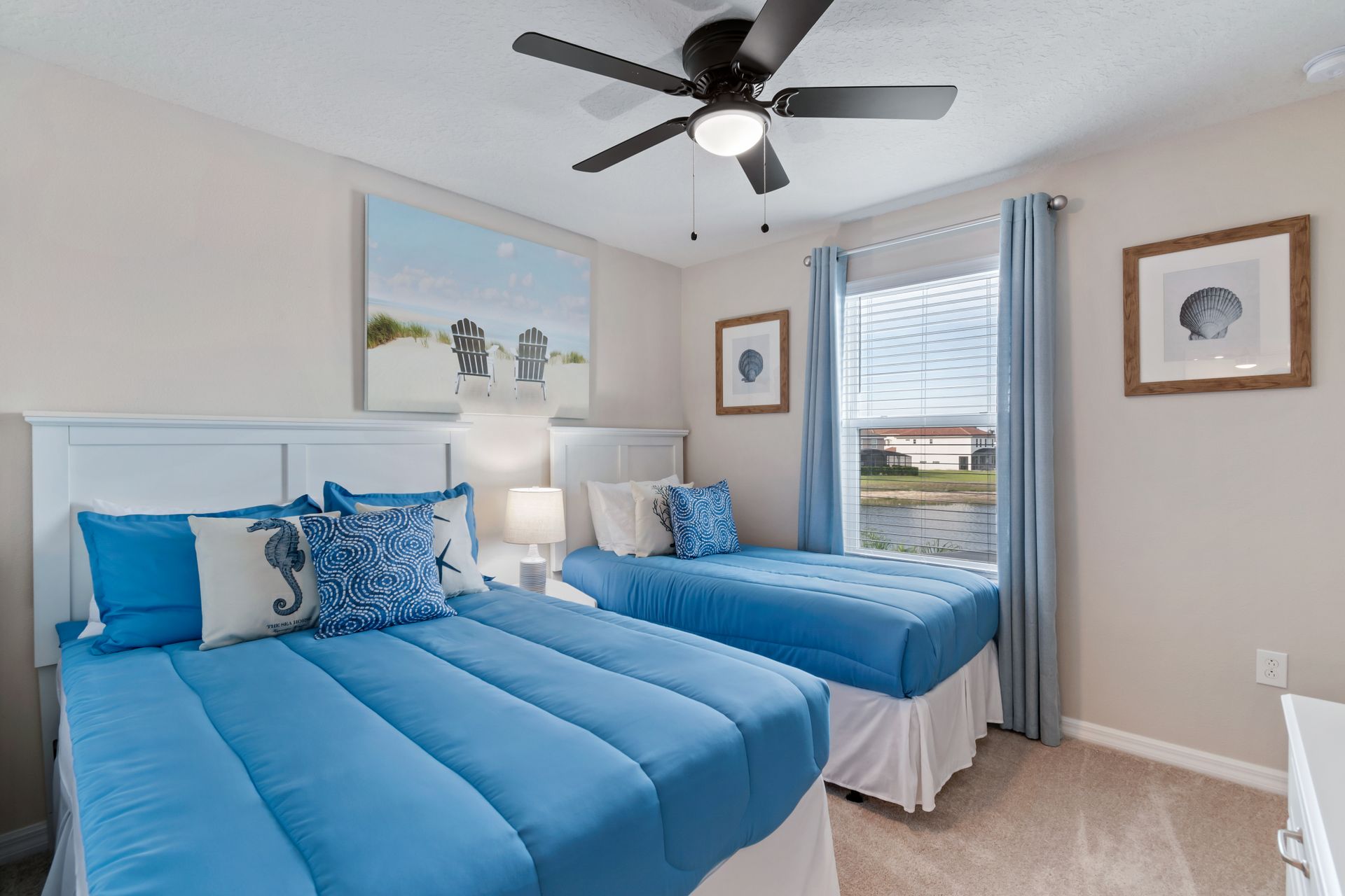 Serenely designed bedroom with one full bed and one twin bed, offering a peaceful and comfortable retreat for a restful night's sleep