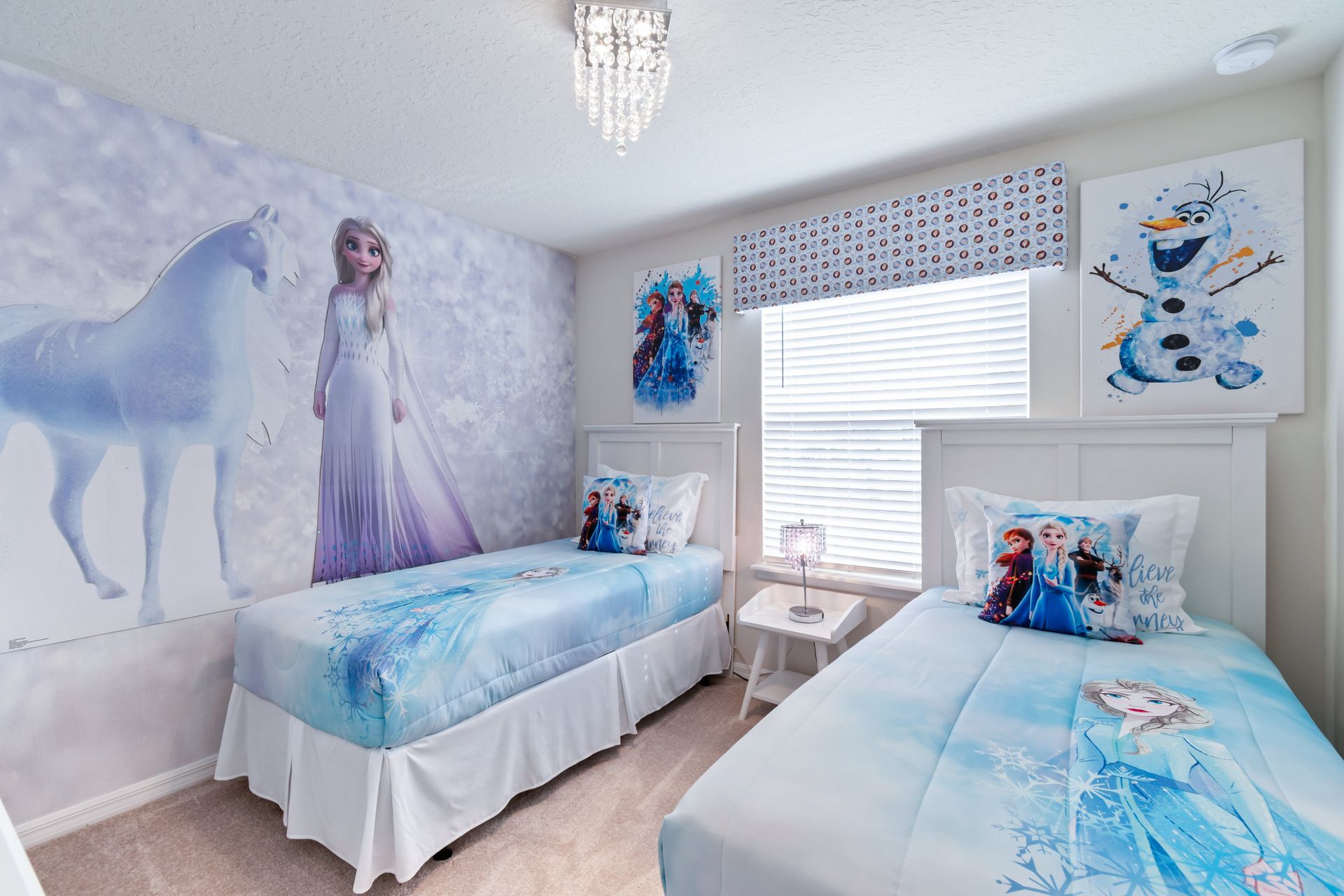 Children will delight in the enchanting upstairs bedroom adorned with a captivating Frozen theme, creating a magical and memorable space