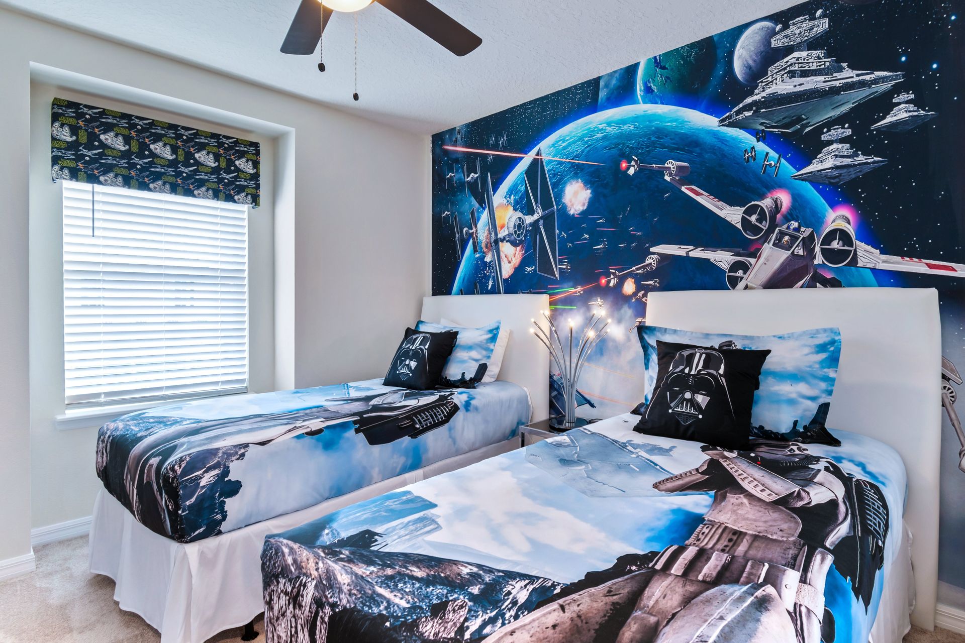 Star Wars-themed room featuring two twin beds, providing a galactic and immersive sleeping space for fans of the iconic franchise