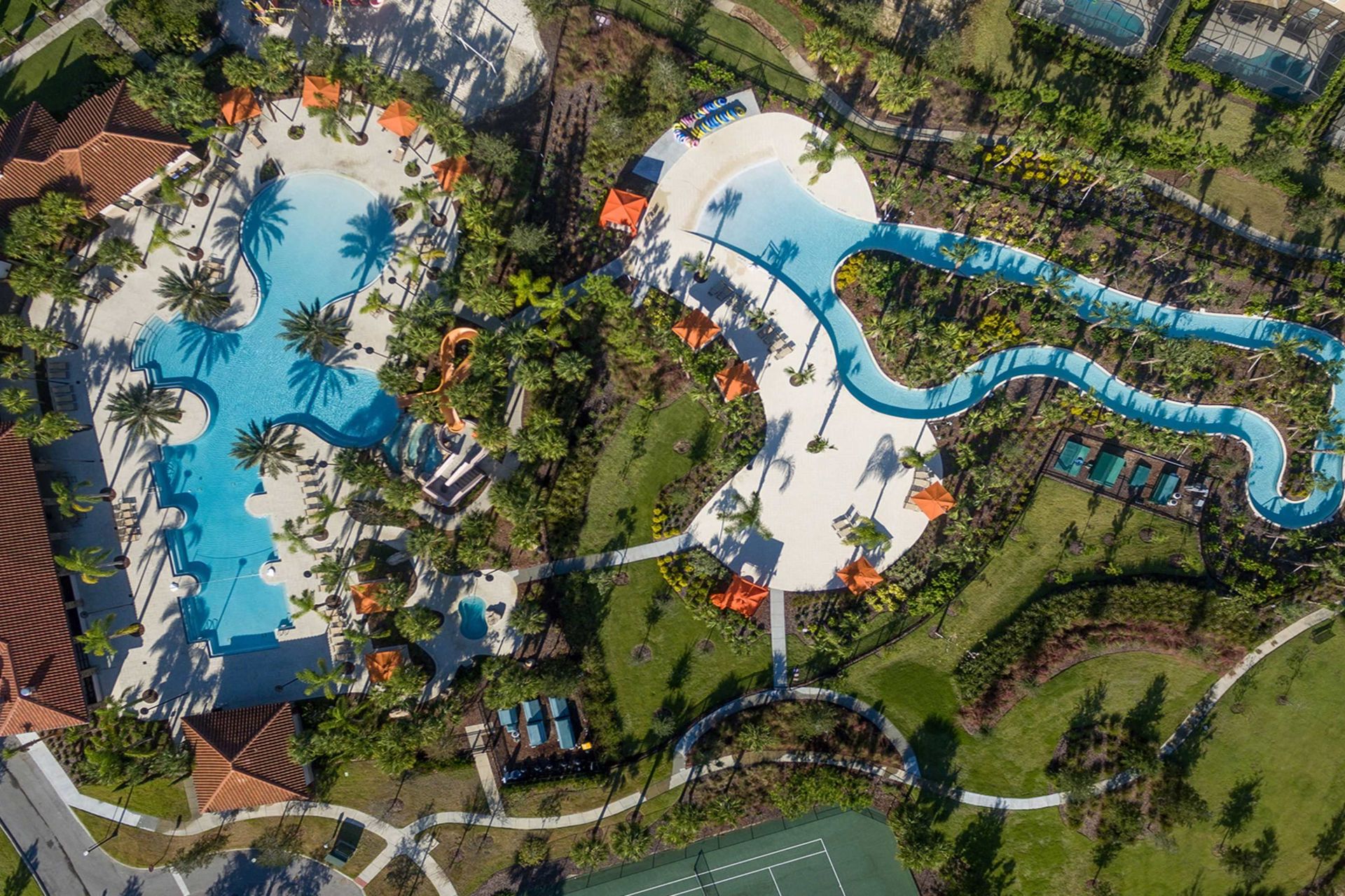 Resort Amenities - Indulge in ultimate relaxation as you float in the sun-kissed waters of the resort lazy pool, offering a serene retreat just steps from your door.