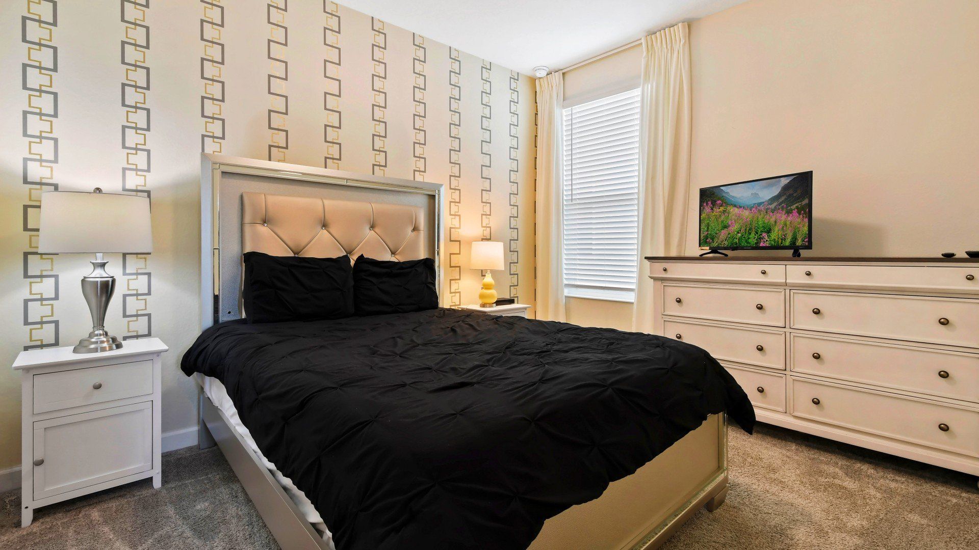Chic bedroom with a stylish design, cozy bedding, and elegant modern touches