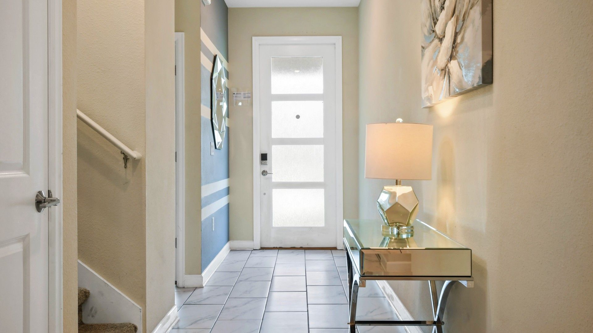Stylish entryway with modern decor, elegant lighting, and a welcoming ambiance