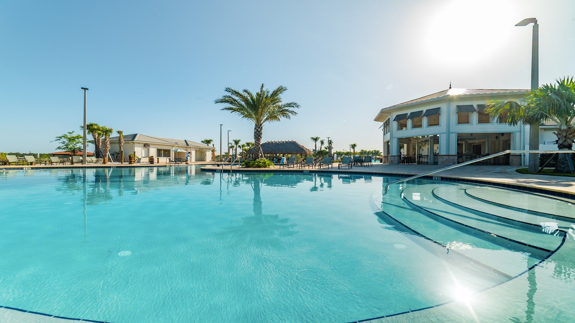 Enjoy sun-soaked days at the clubhouse pool with loungers, shade, and style