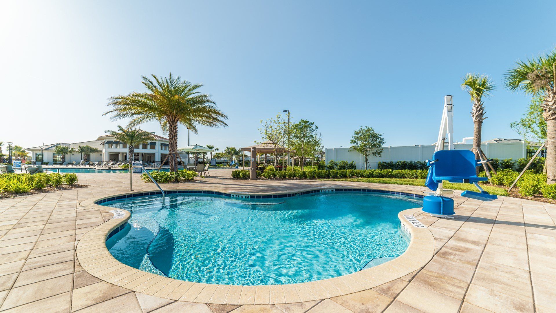 Unwind in a serene lakeside spa surrounded by palms and peaceful water views