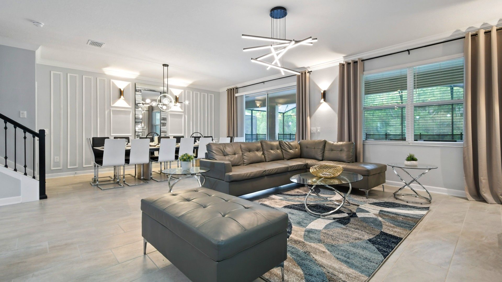 Elegant open-concept living and dining area with modern décor and stylish lighting.