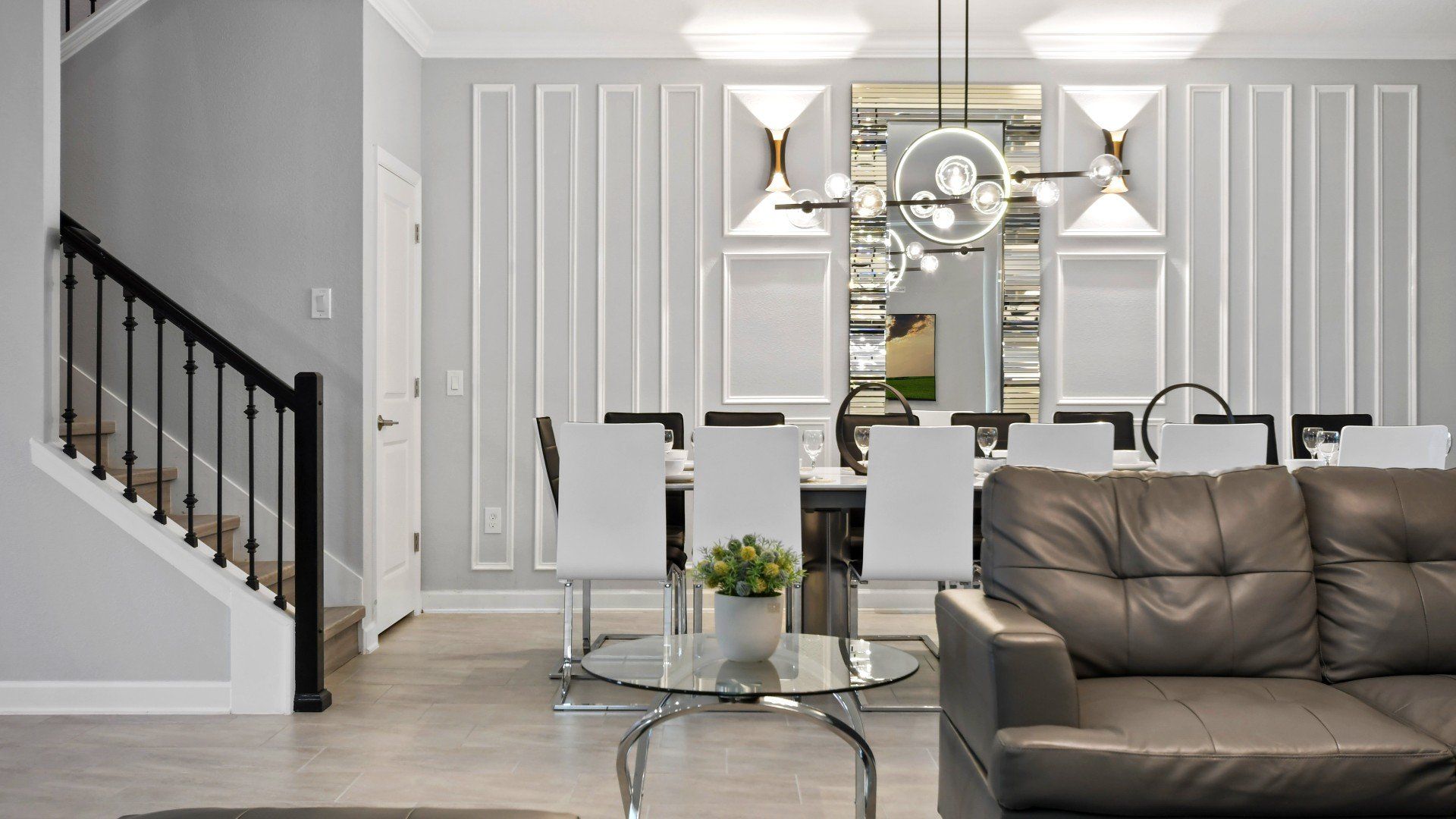 Elegant dining area with modern lighting, stylish decor, and a sleek open-concept design.