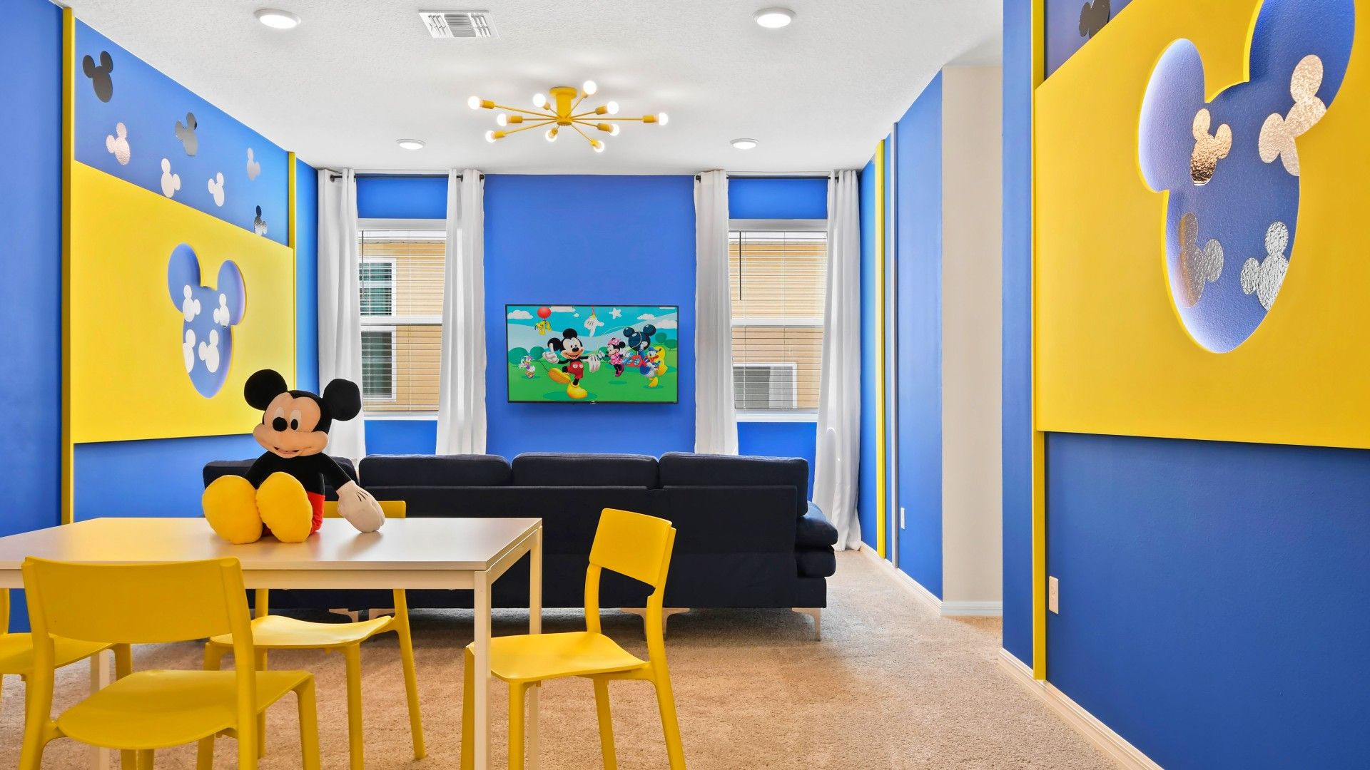 Whimsical Mickey-themed room perfect for families—fun, vibrant, and cozy stay!