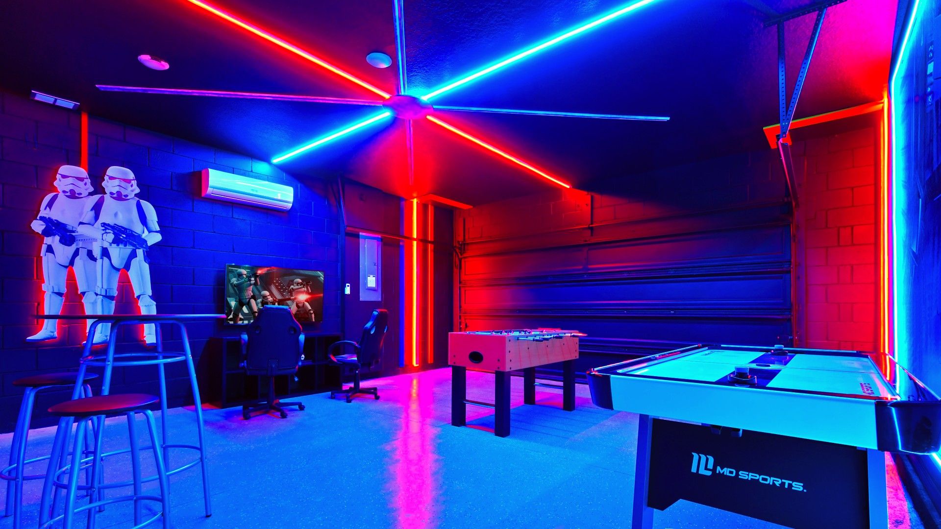 Epic Star Wars-themed game room with neon lights, foosball, and air hockey!