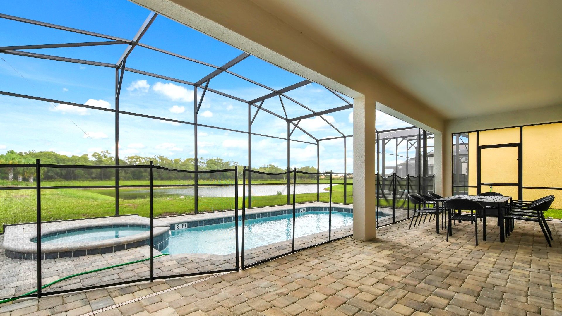 Relax in this screened-in patio with a private pool, spa, and stunning lake views!