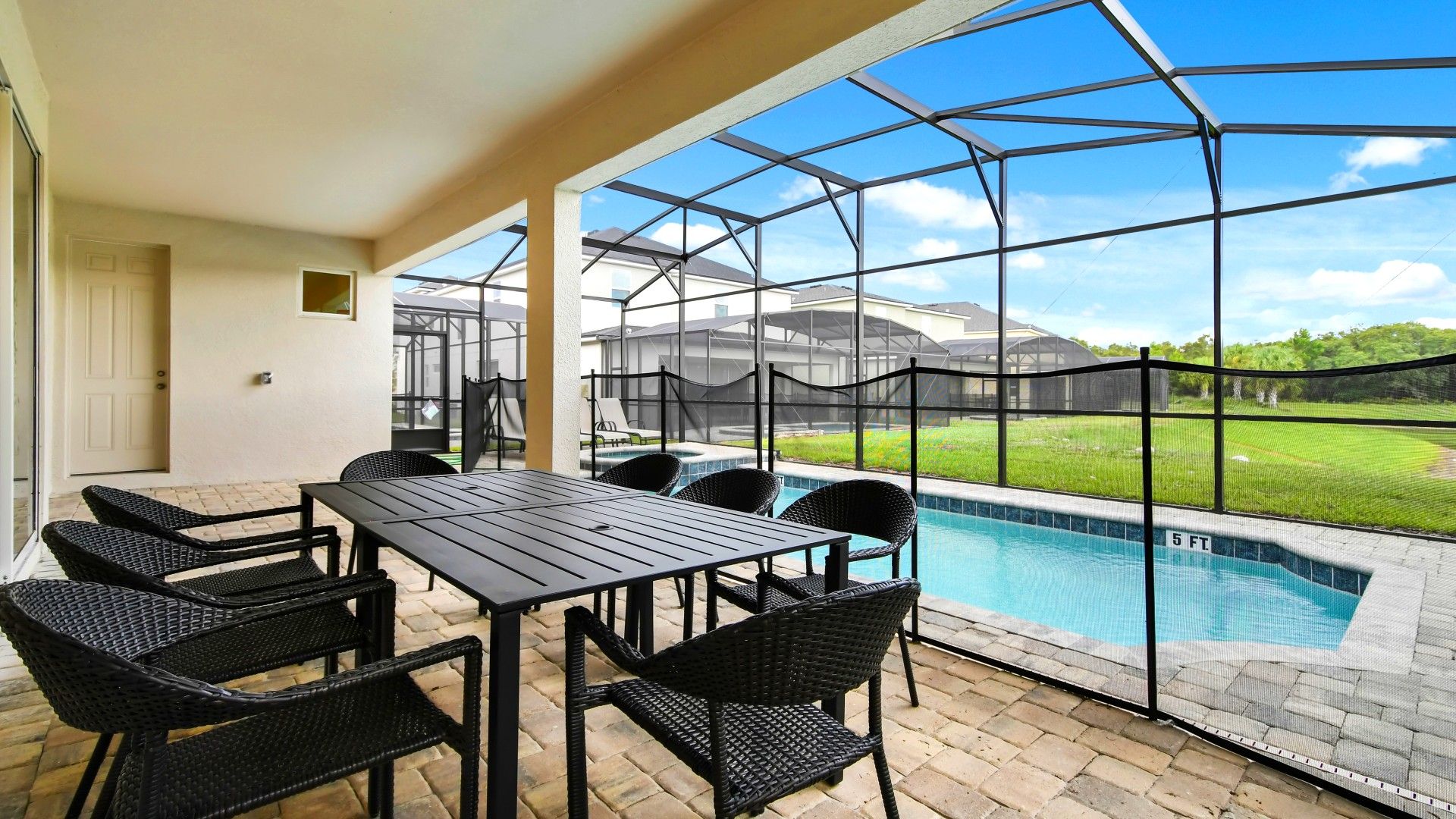 Relax in this screened patio with a private pool, outdoor dining, and lush views!