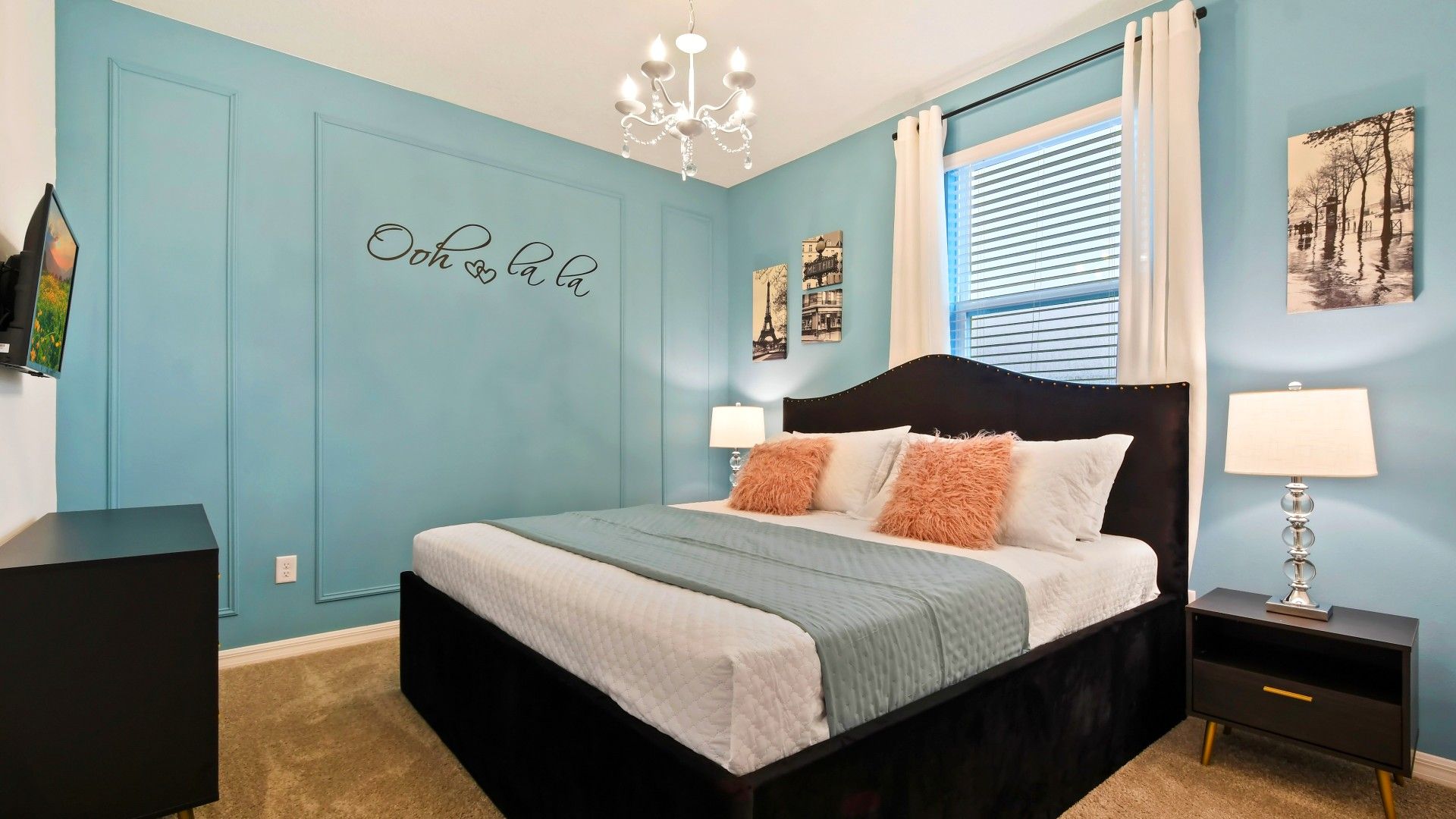 Chic Parisian-inspired bedroom with cozy king bed, soft decor, and elegant charm