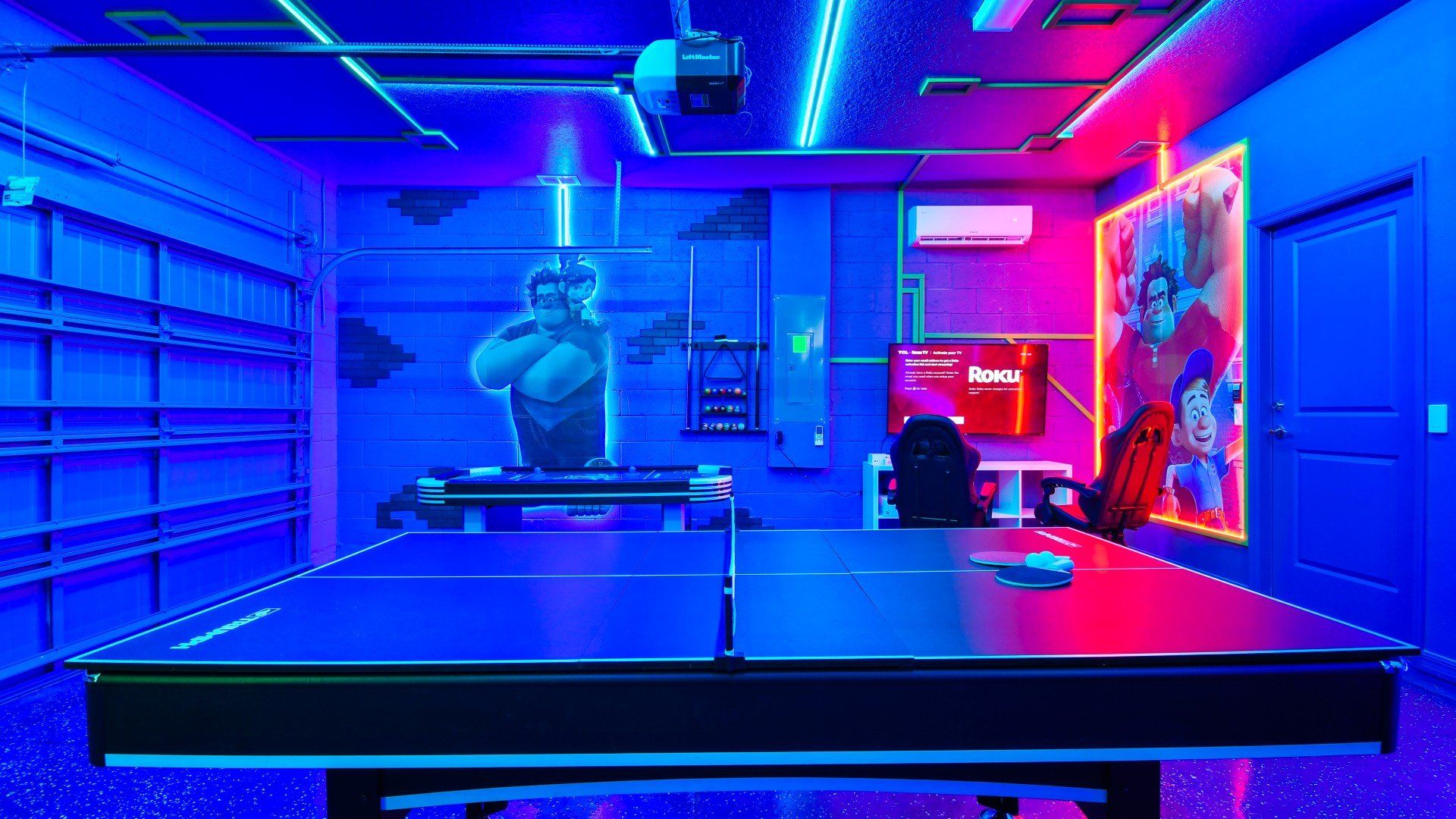 Glow-in-the-dark game room with ping pong, arcade vibes, and Wreck-It Ralph fun.