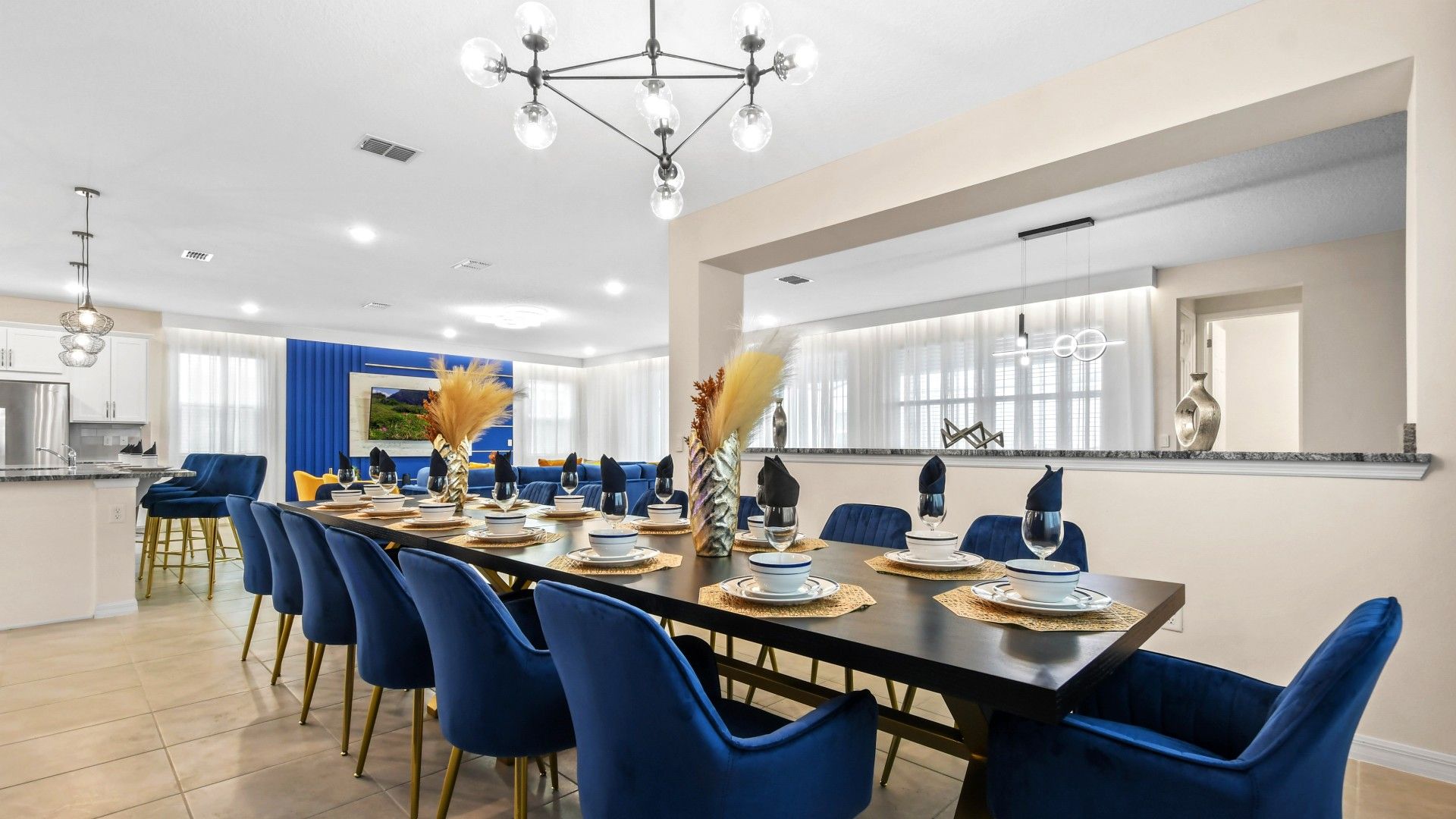 Elegant Dining Space: Sleek Blue Chairs, Modern Decor & Style!