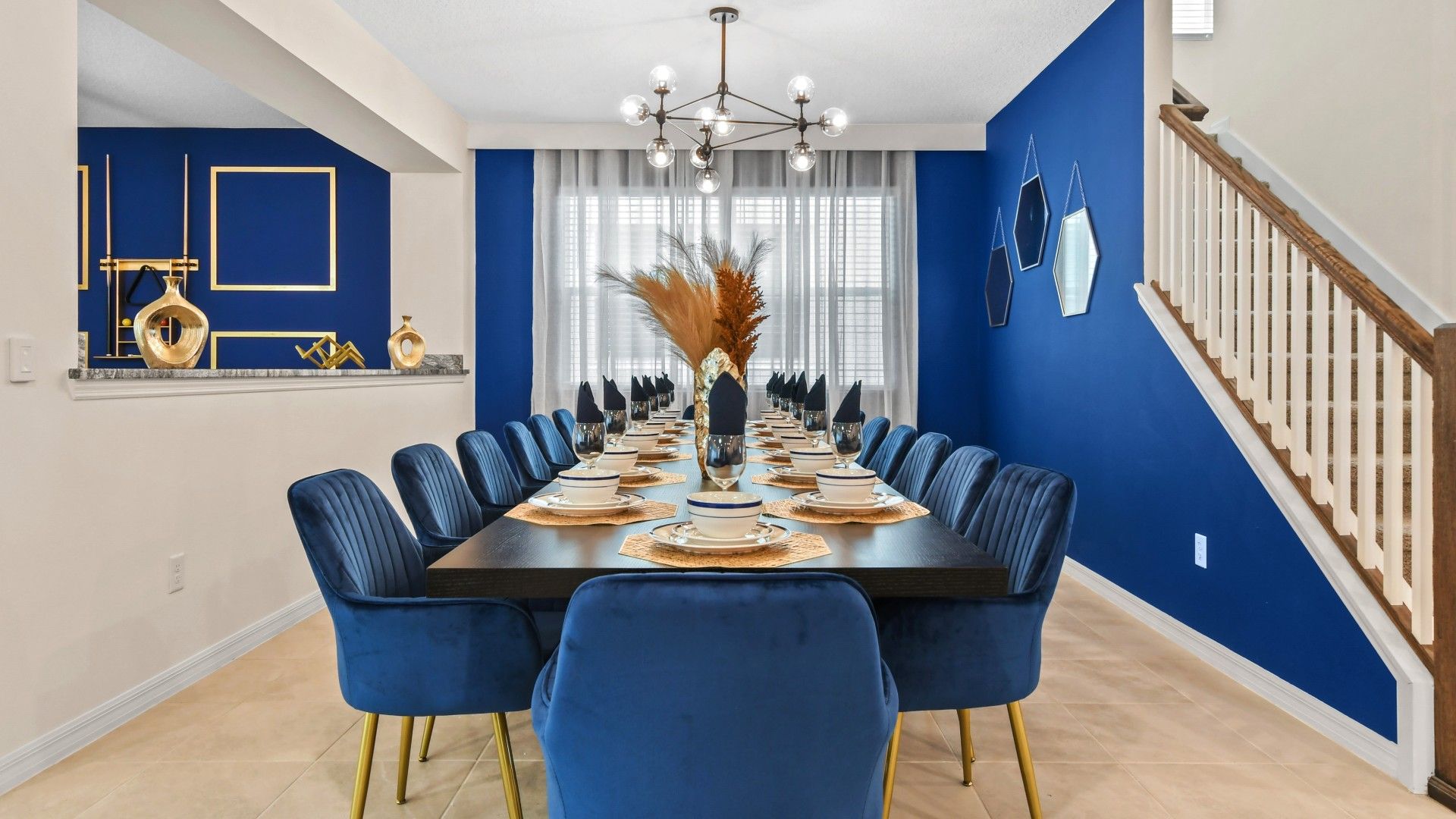 Stunning Dining Room: Bold Blue Walls, Elegant Seating & Style!