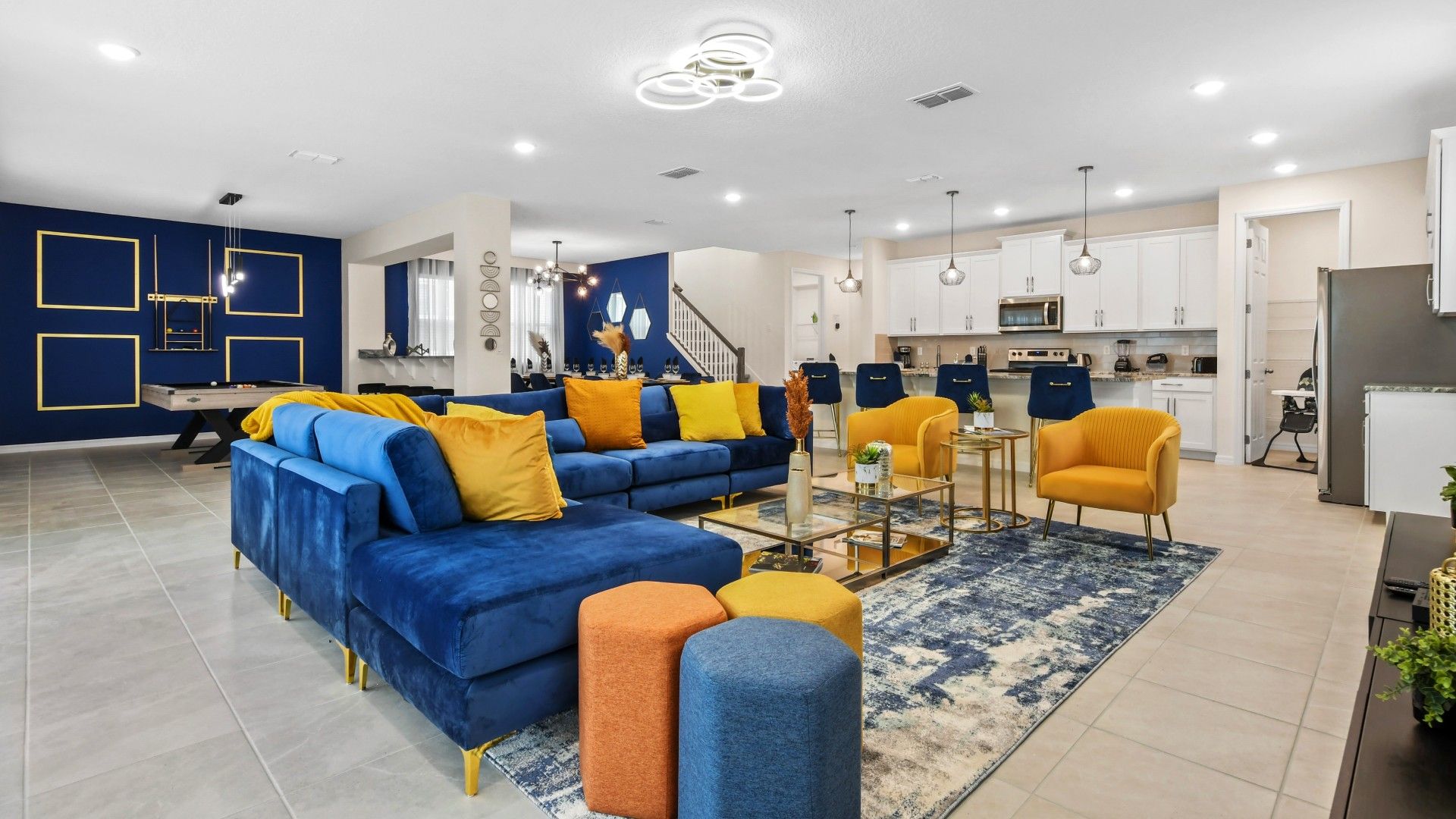 Welcome your family to a spacious living room area, featuring a sumptuous and cozy sofa.