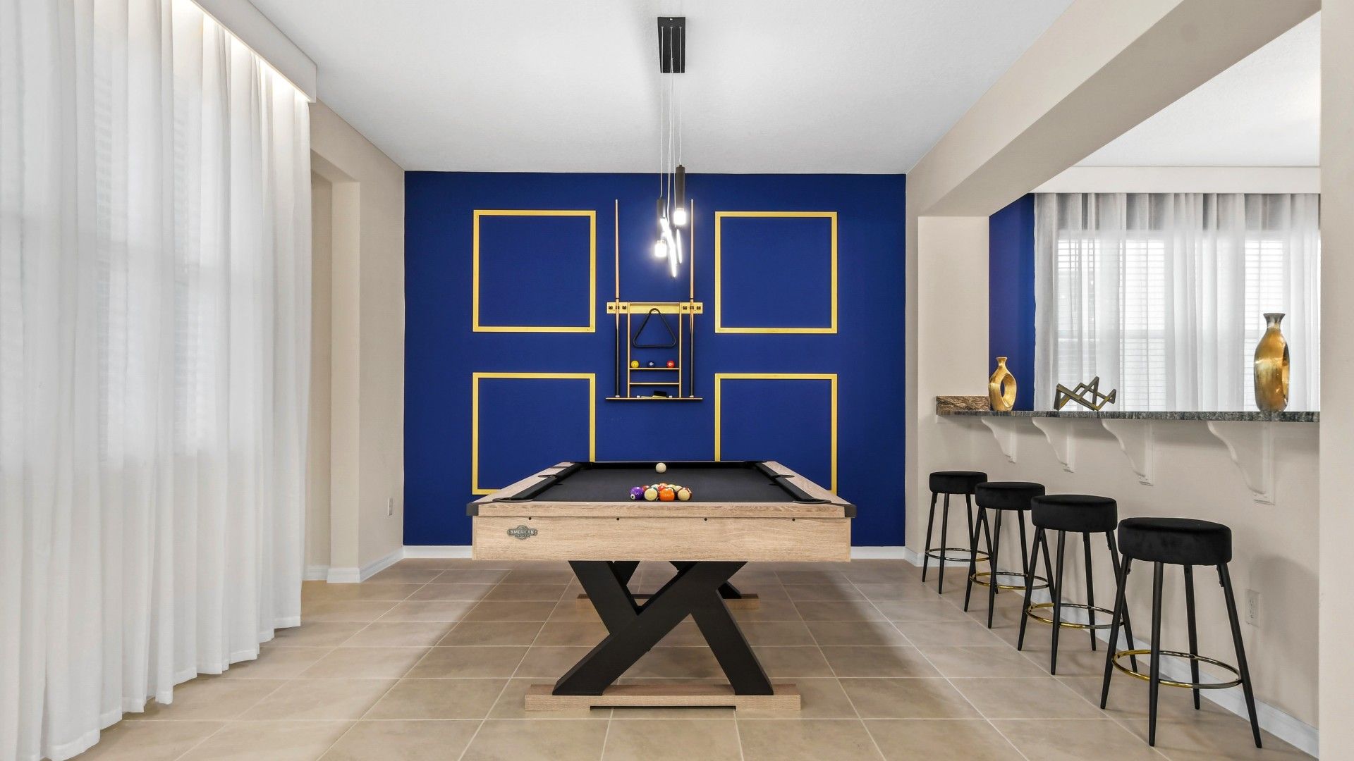 Chic Game Room: Modern Pool Table, Bold Blue Walls & Gold Accents!