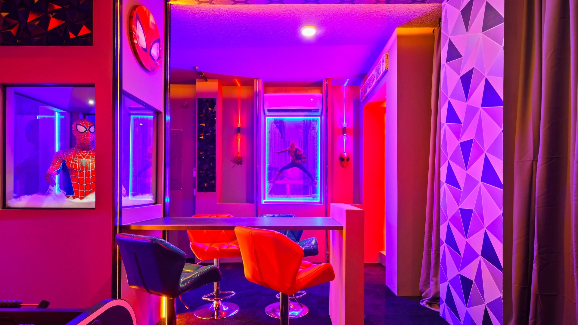 Spider-Man-themed game room, where web-slinging decor and immersive graphics set the stage for thrilling gaming adventures.