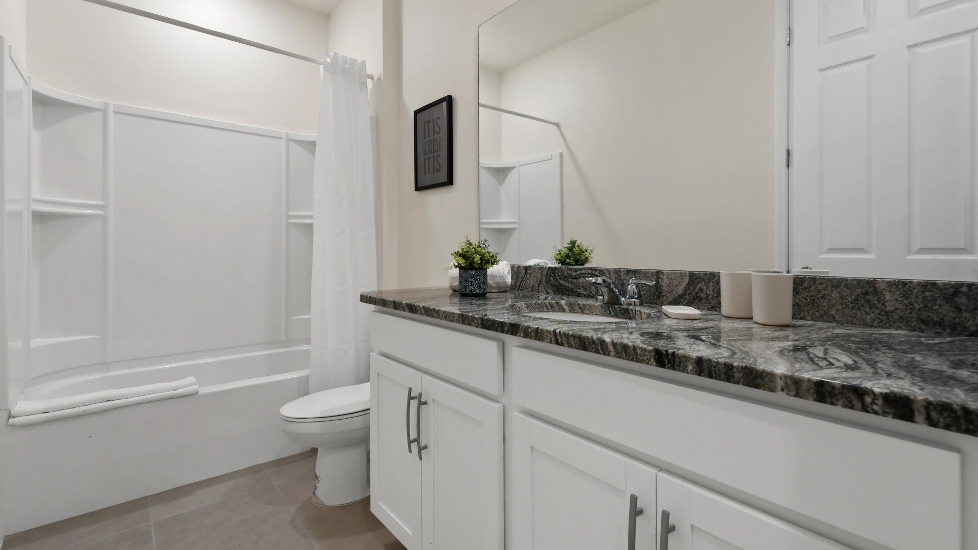 Indulge in the luxury of a full bathroom, complete with modern amenities and elegant finishes, providing a spa-like oasis for your personal comfort and relaxation.