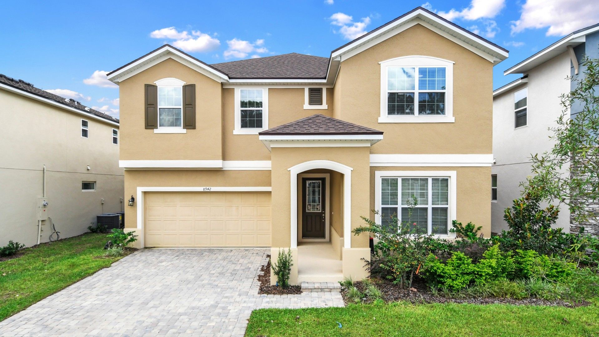 Step into a modern home surrounded by lush greenery. And a garage seamlessly integrates with sleek architectural design